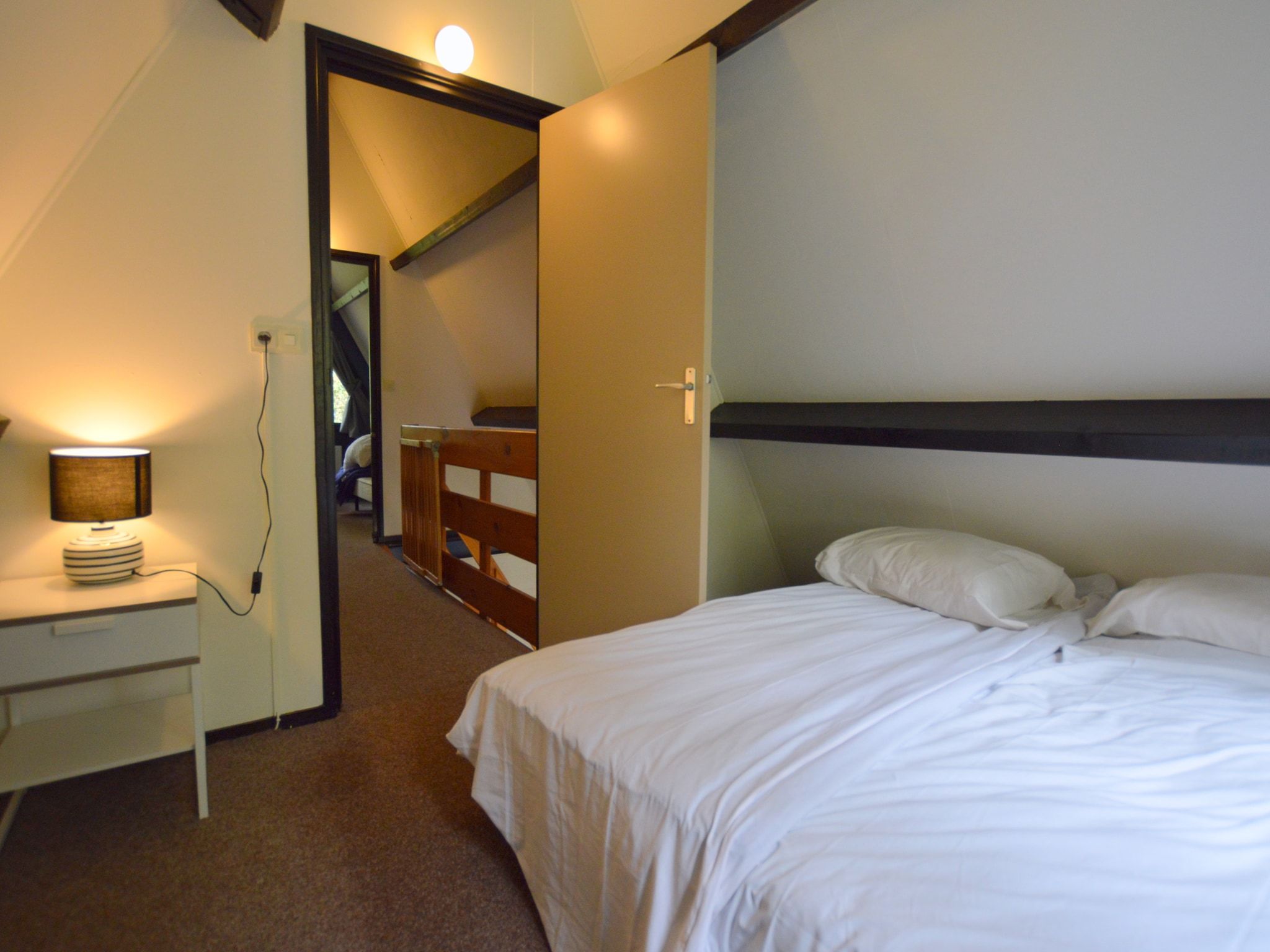 Een slaapkamer van Anjer Bungalow 61 in Stramproy