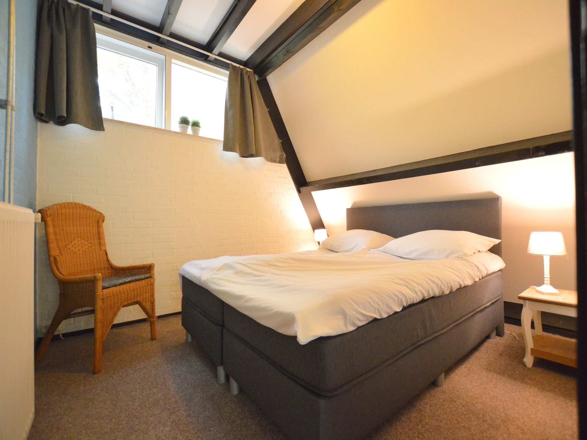 Een slaapkamer van Anjer Bungalow 61 in Stramproy