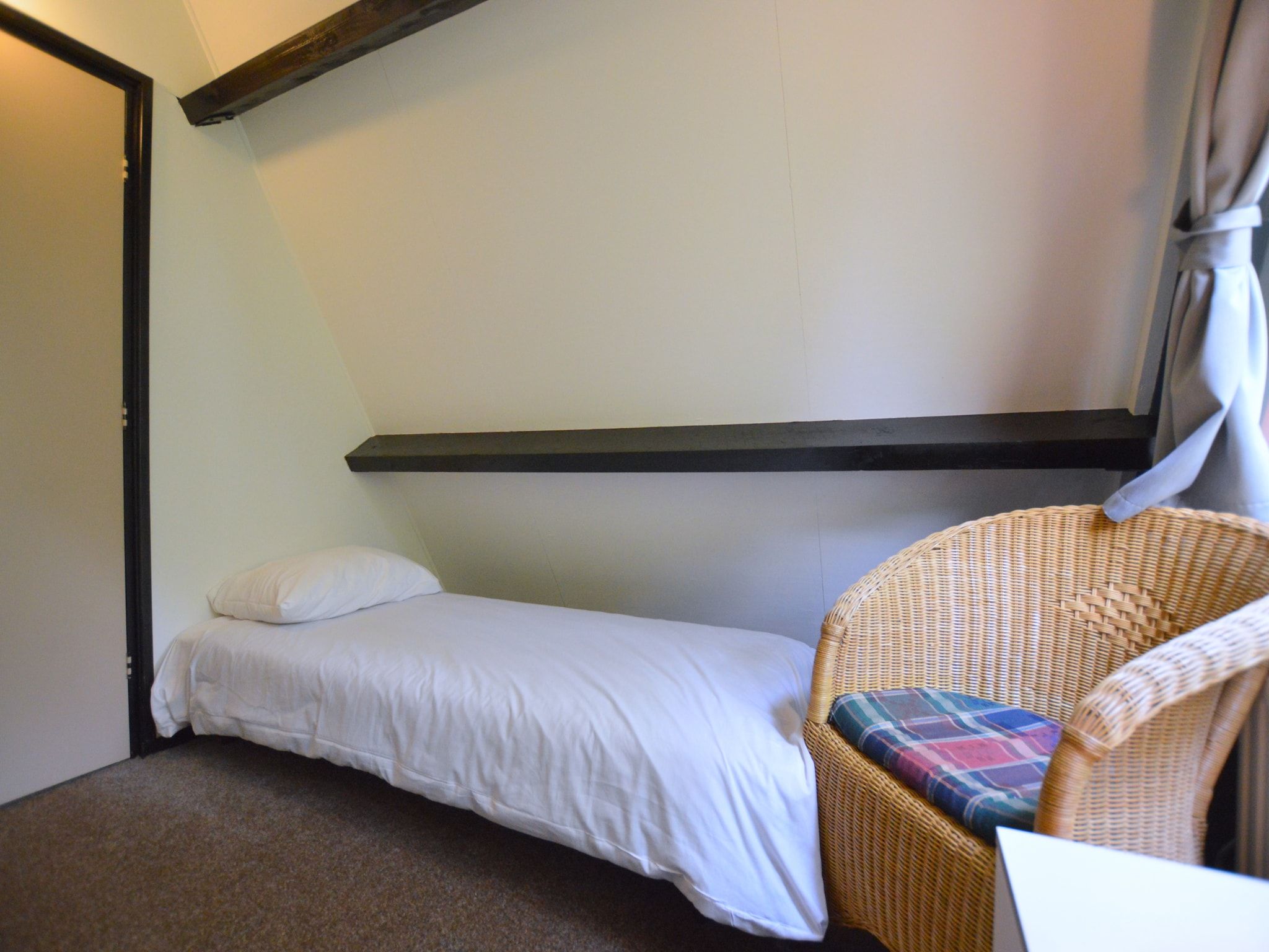 Een slaapkamer van Anjer Bungalow 61 in Stramproy