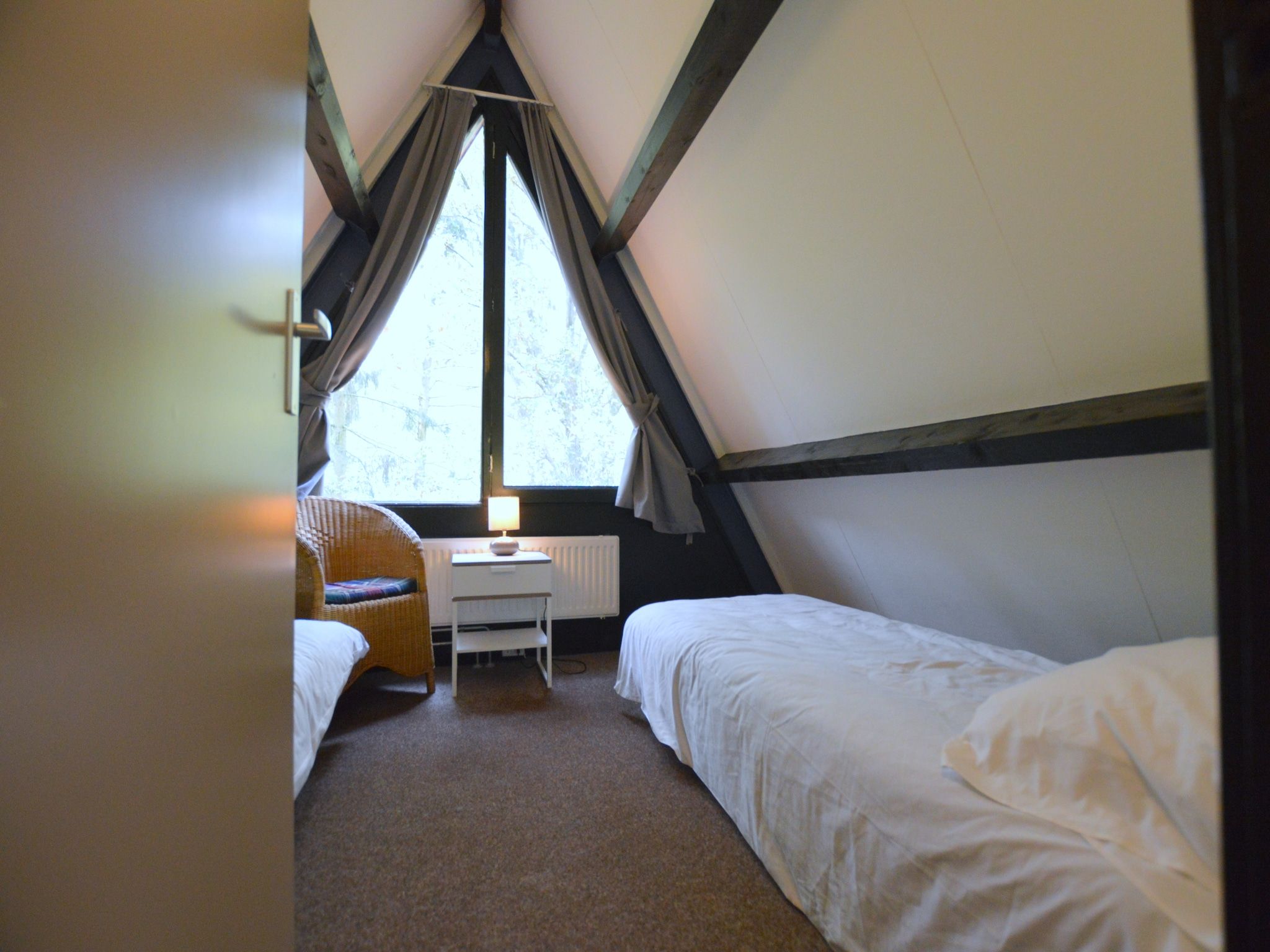 Een slaapkamer van Anjer Bungalow 61 in Stramproy