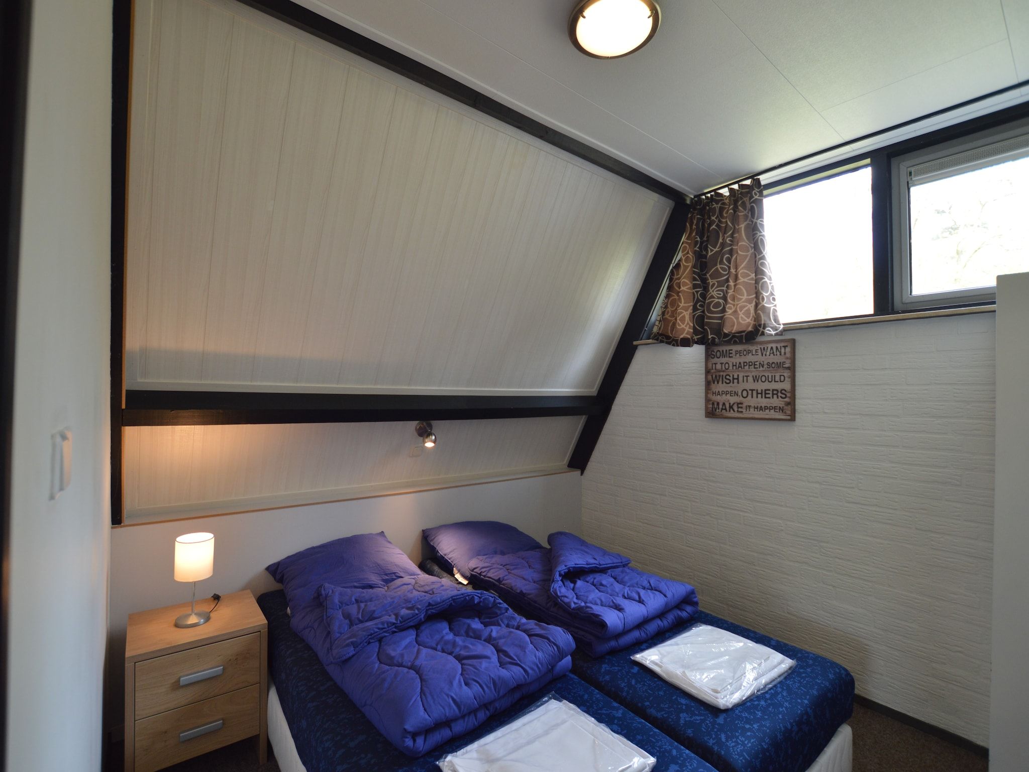 Een slaapkamer van Bungalows 48 en 49 in Stramproy