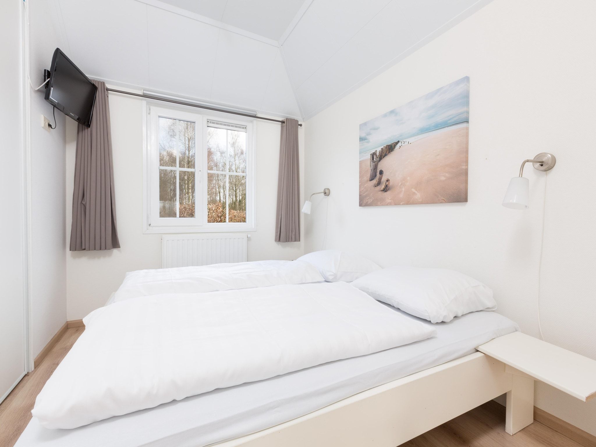 Een slaapkamer van Recreatiepark Tolplas 15 in Hoge Hexel