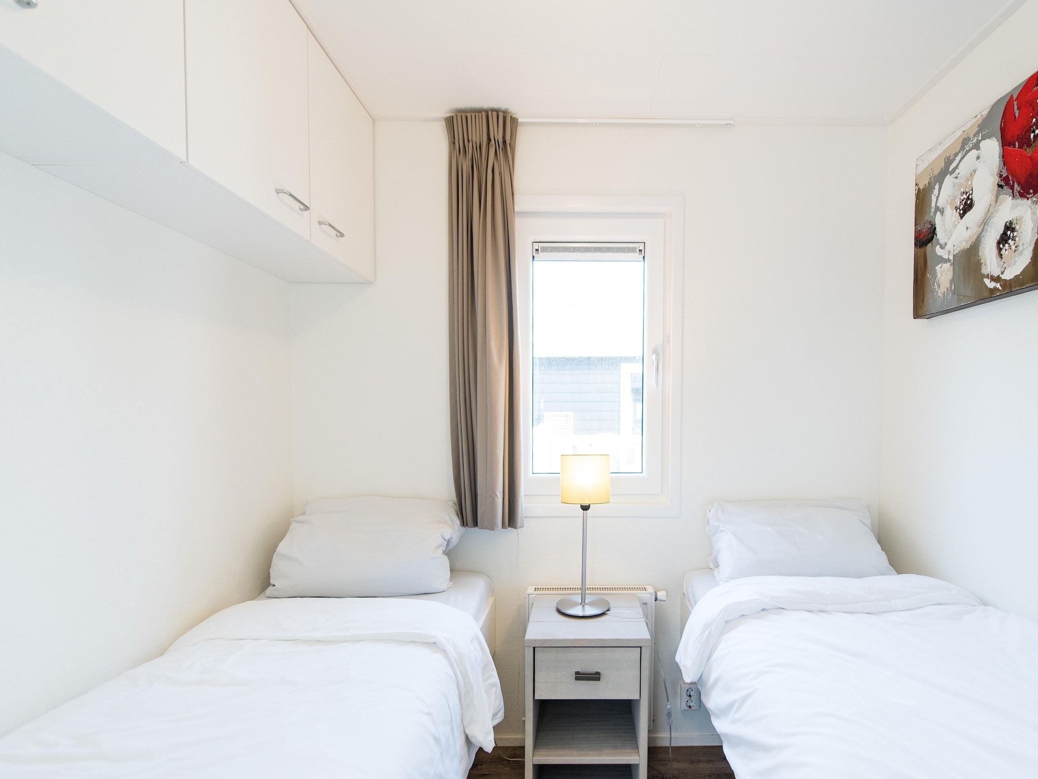 Een slaapkamer van Vakantiepark Boomhiemke 6 in Hollum-Ameland