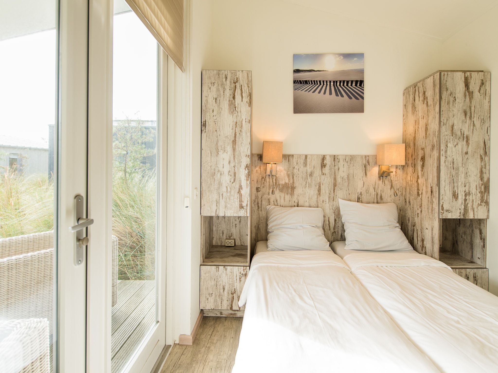 Een slaapkamer van Vakantiepark Boomhiemke 7 in Hollum-Ameland