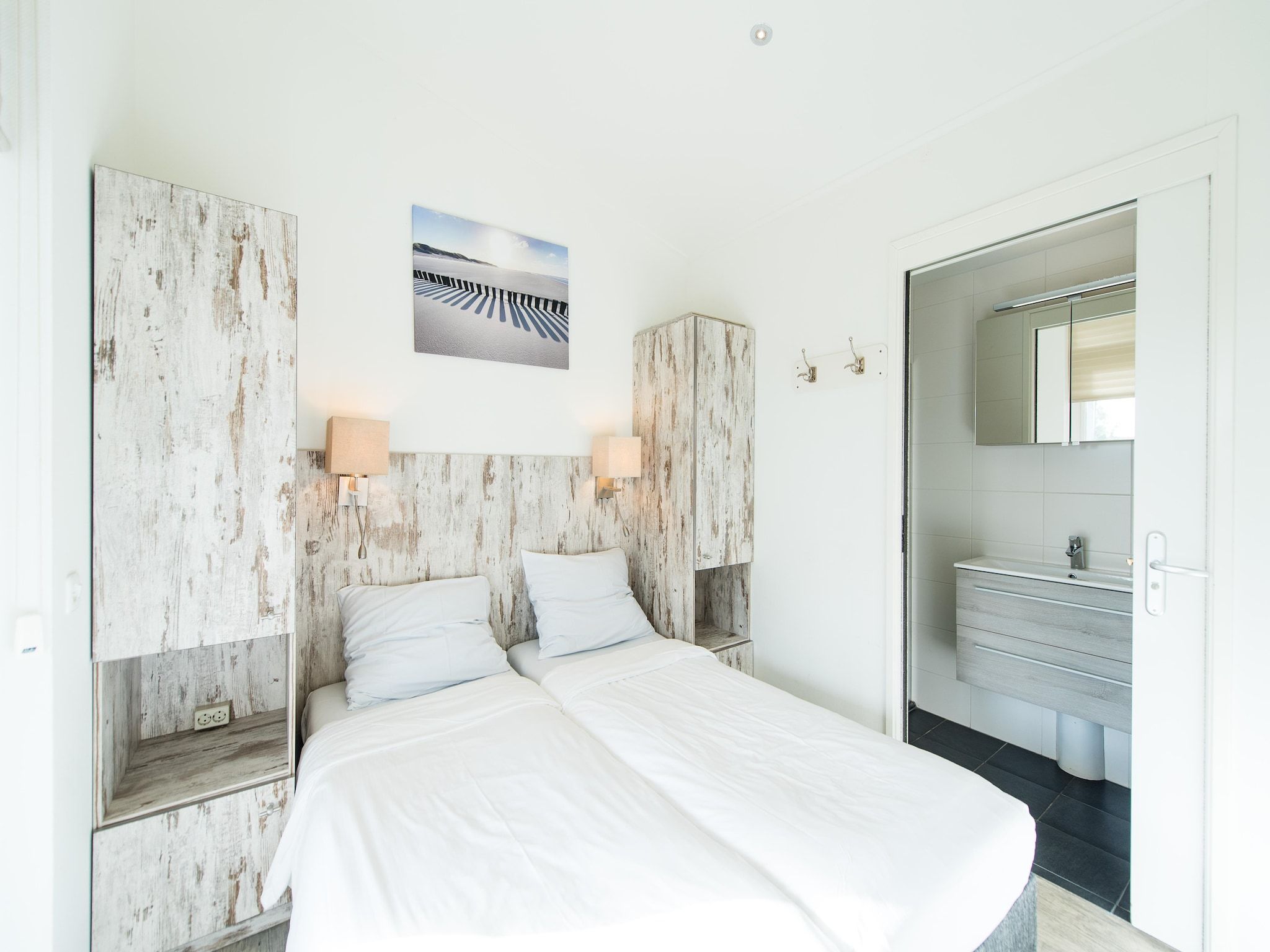 Een slaapkamer van Vakantiepark Boomhiemke 7 in Hollum-Ameland