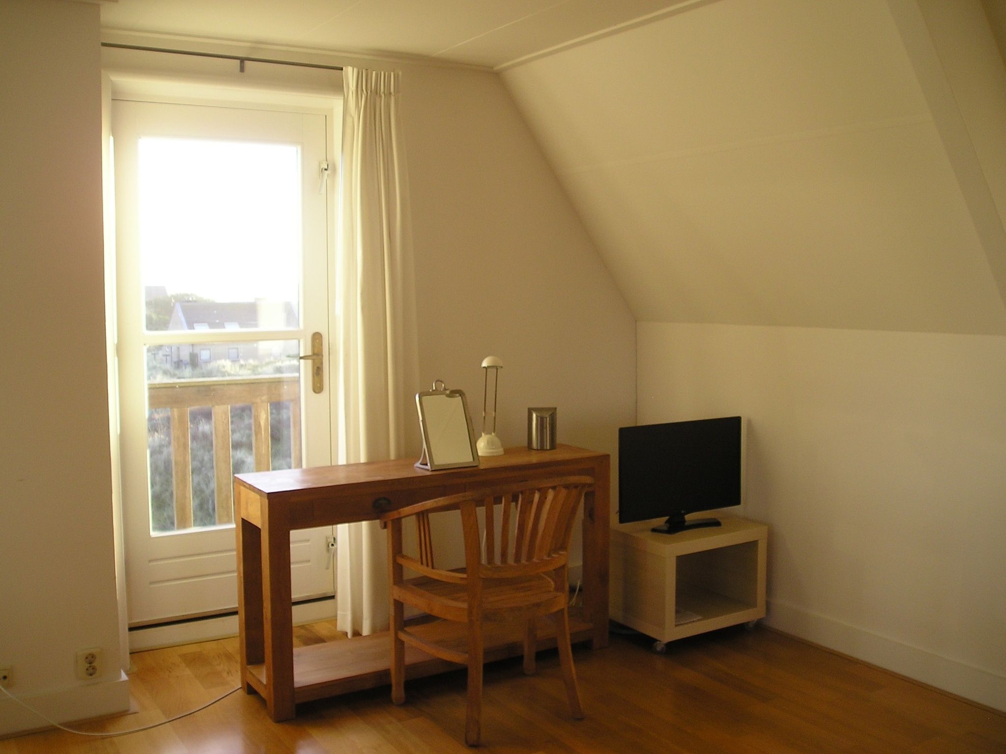 Een slaapkamer van Duindroom op Terschelling in Midsland Terschelling