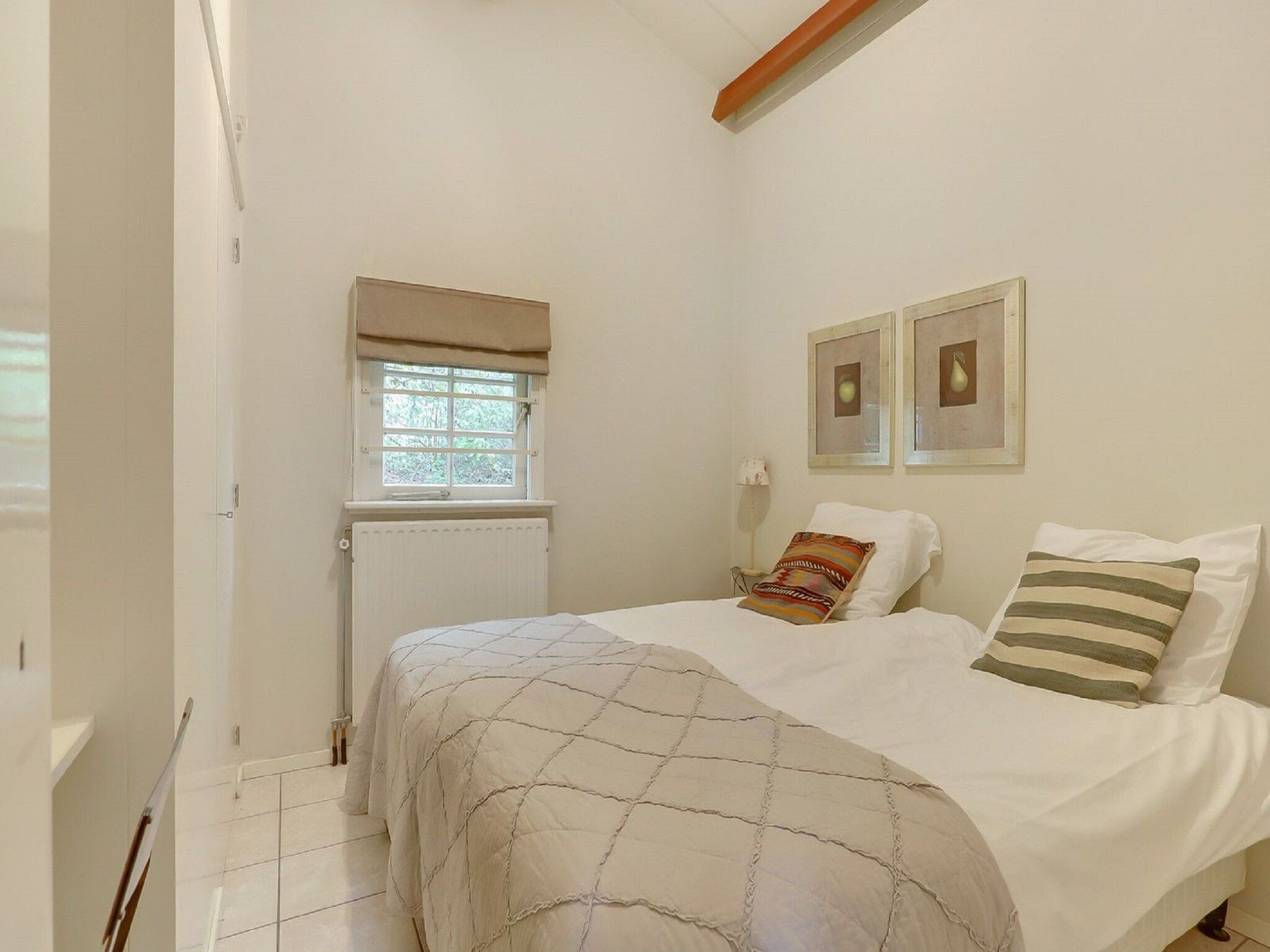 Een slaapkamer van Vakantiepark Sandberghe 3 in Uden