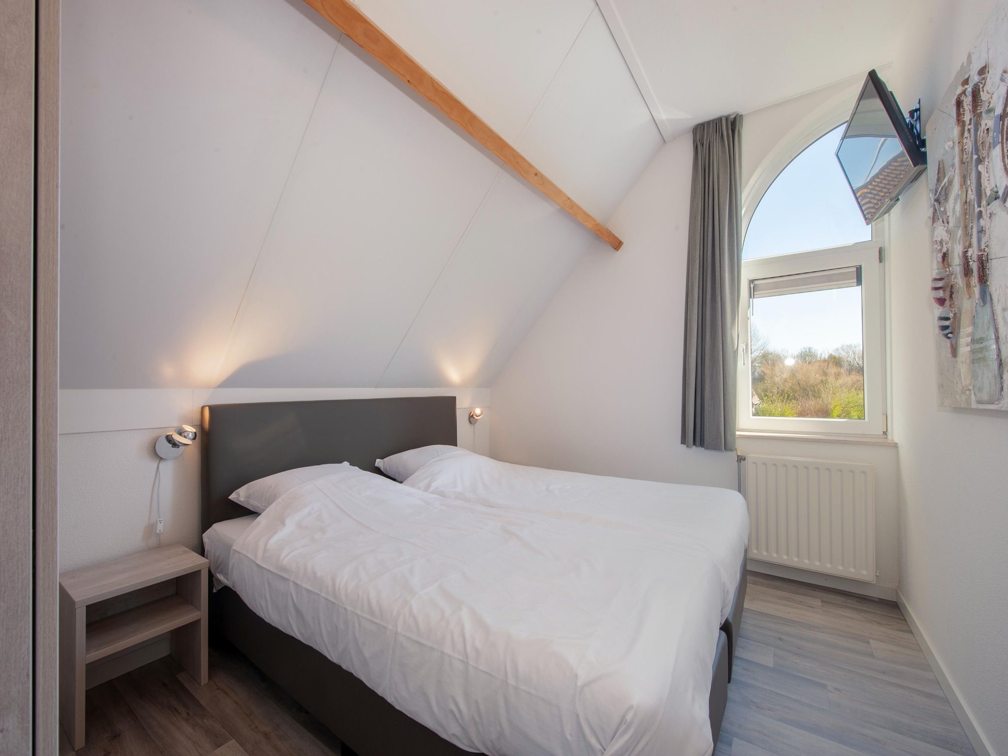 Een slaapkamer van Noordzee Résidence De Banjaard 8 in Kamperland