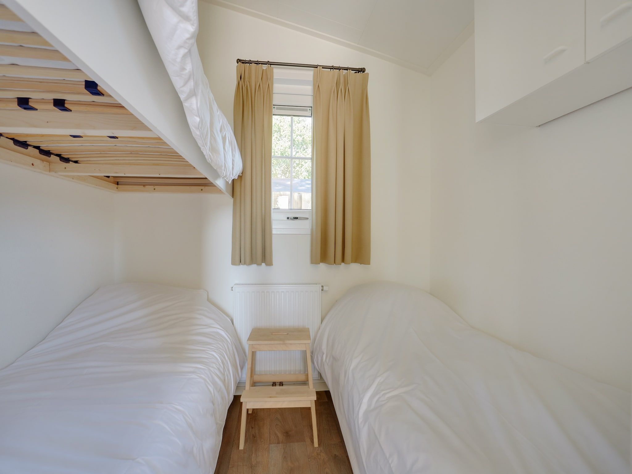 Een slaapkamer van Vakantiepark Sandberghe 6 in Uden