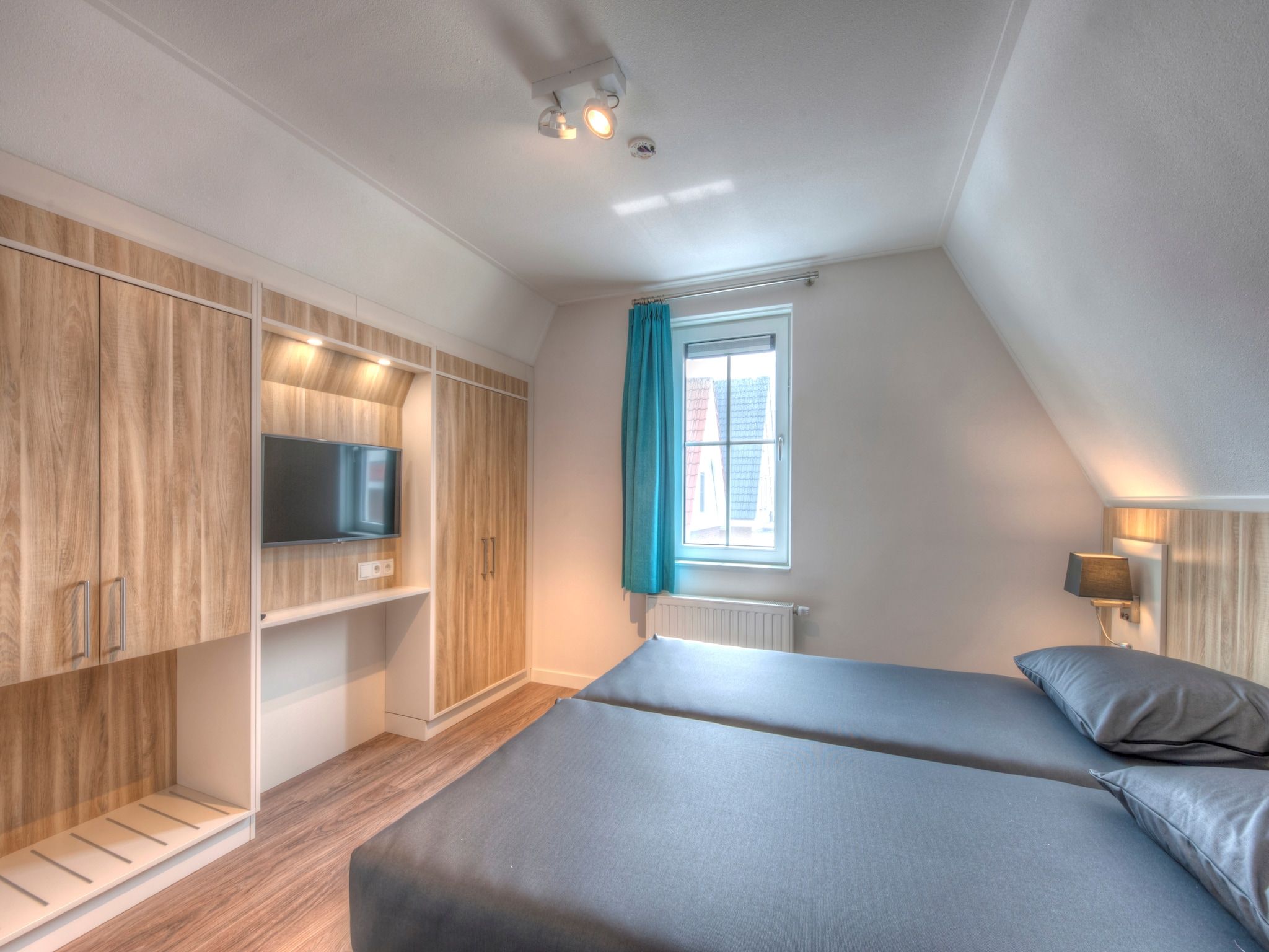 Een slaapkamer van Noordzee Résidence Dishoek 3 in Koudekerke