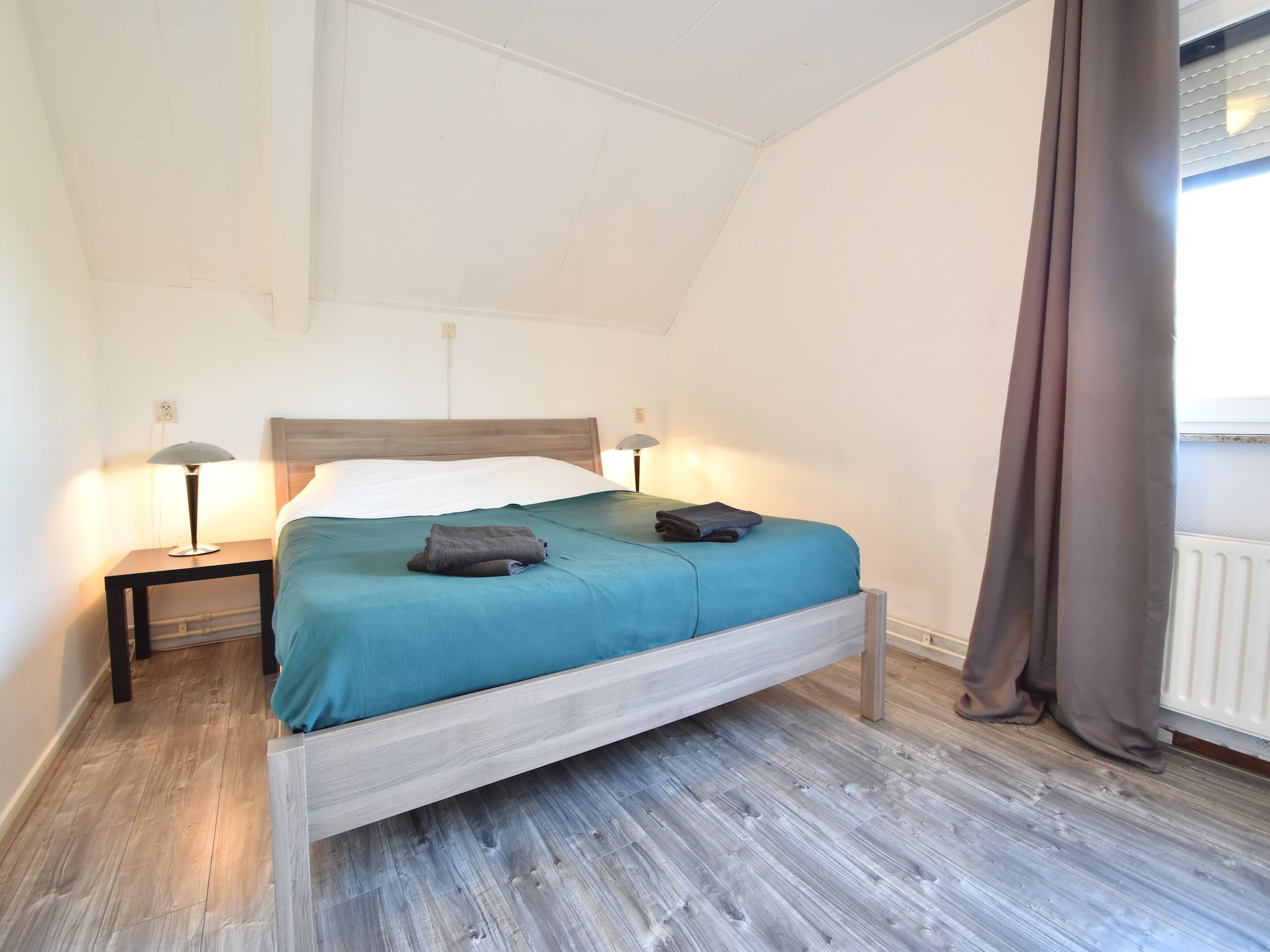 Een slaapkamer van Het Mosselhuys in Bruinisse