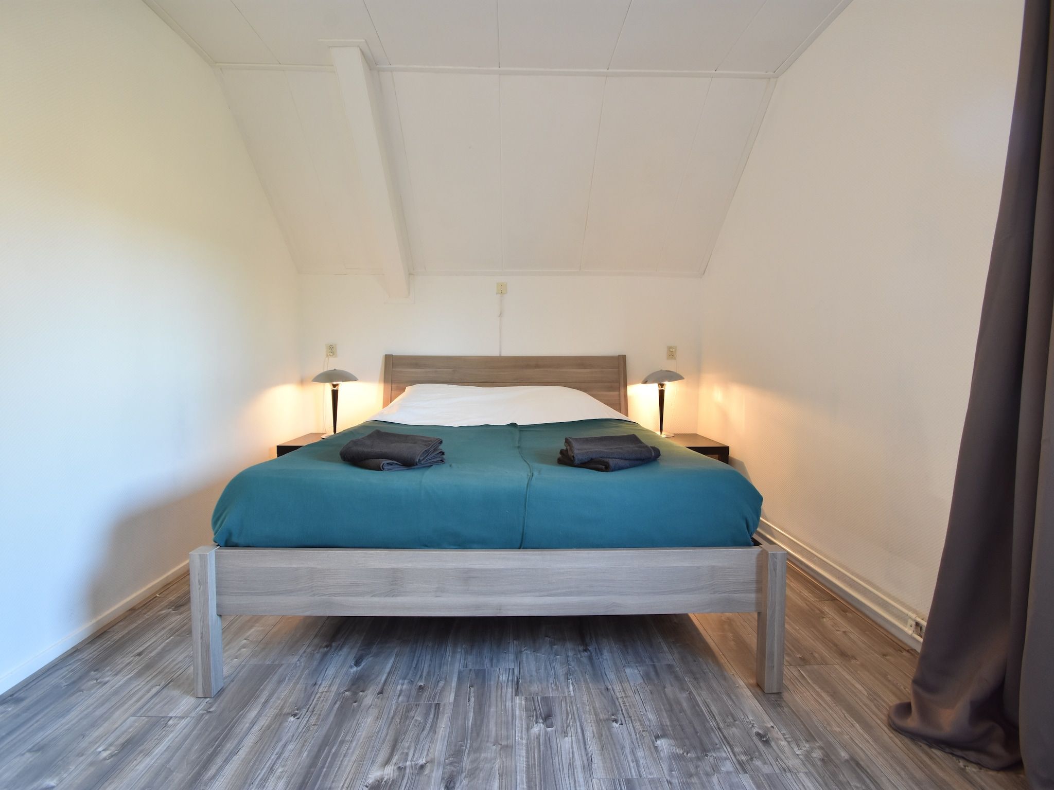 Een slaapkamer van Het Mosselhuys in Bruinisse