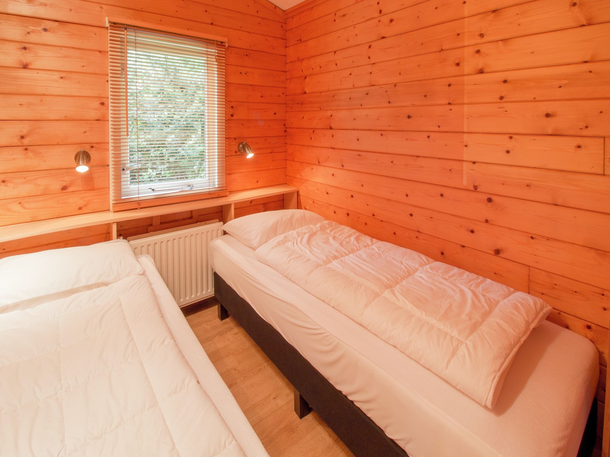 Een slaapkamer van Chaletpark Kuiperberg 4 in Ootmarsum