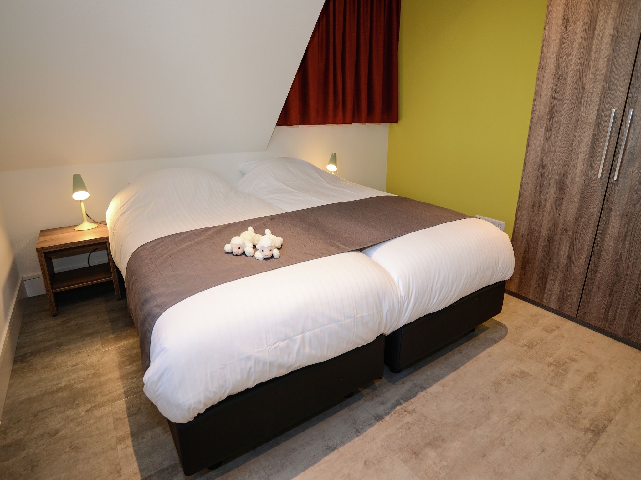 Een slaapkamer van Tempelier 39 in Den Burg-Texel