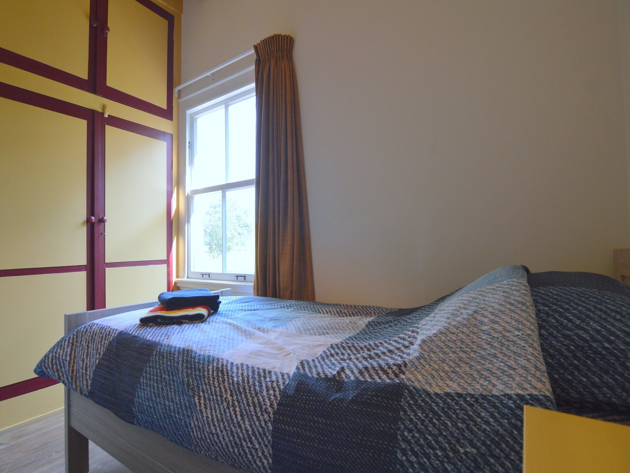 Een slaapkamer van Bakhuus in Geesteren