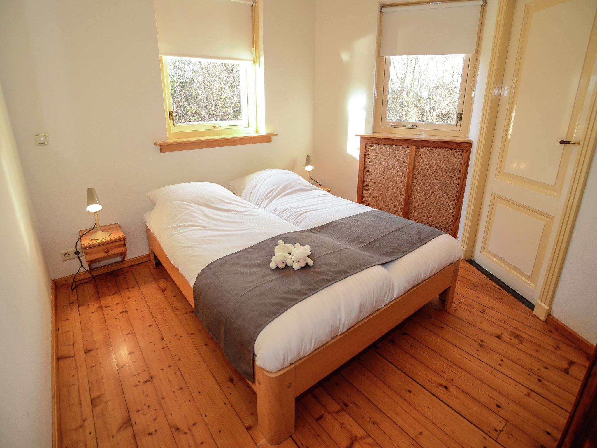 Een slaapkamer van De Kerkuil in De Cocksdorp-Texel