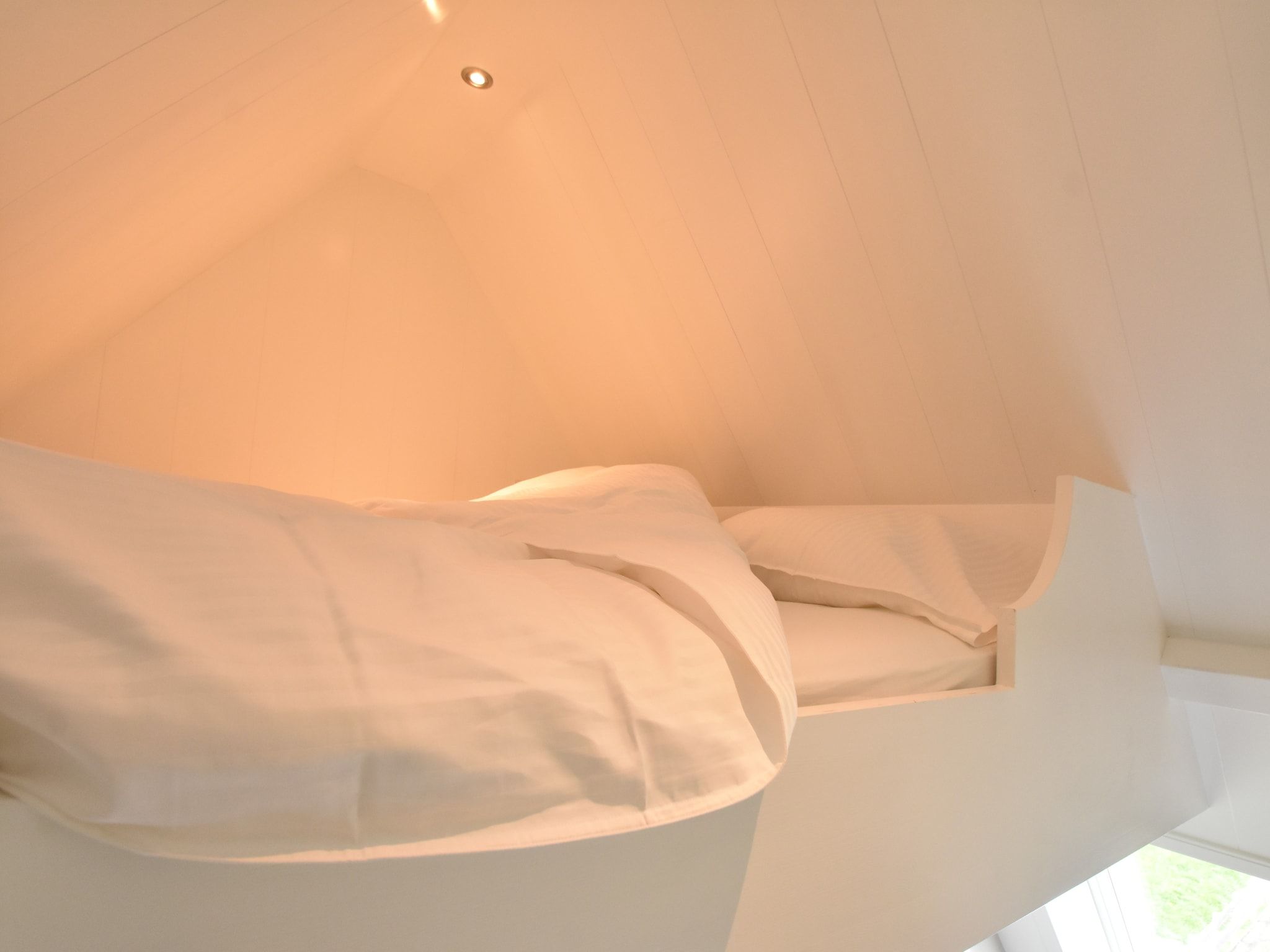 Een slaapkamer van Onder de Molen 24 pers in Middenbeemster