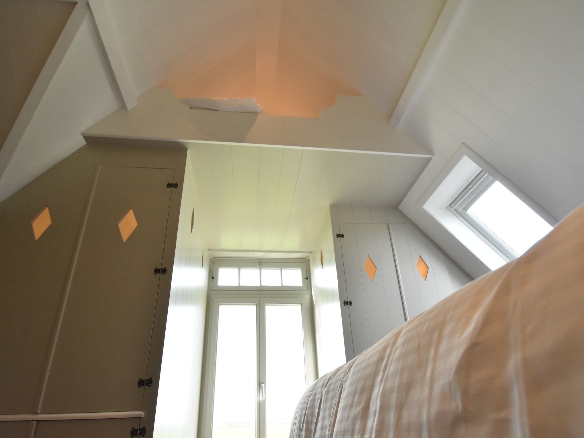 Een slaapkamer van Onder de Molen 24 pers in Middenbeemster