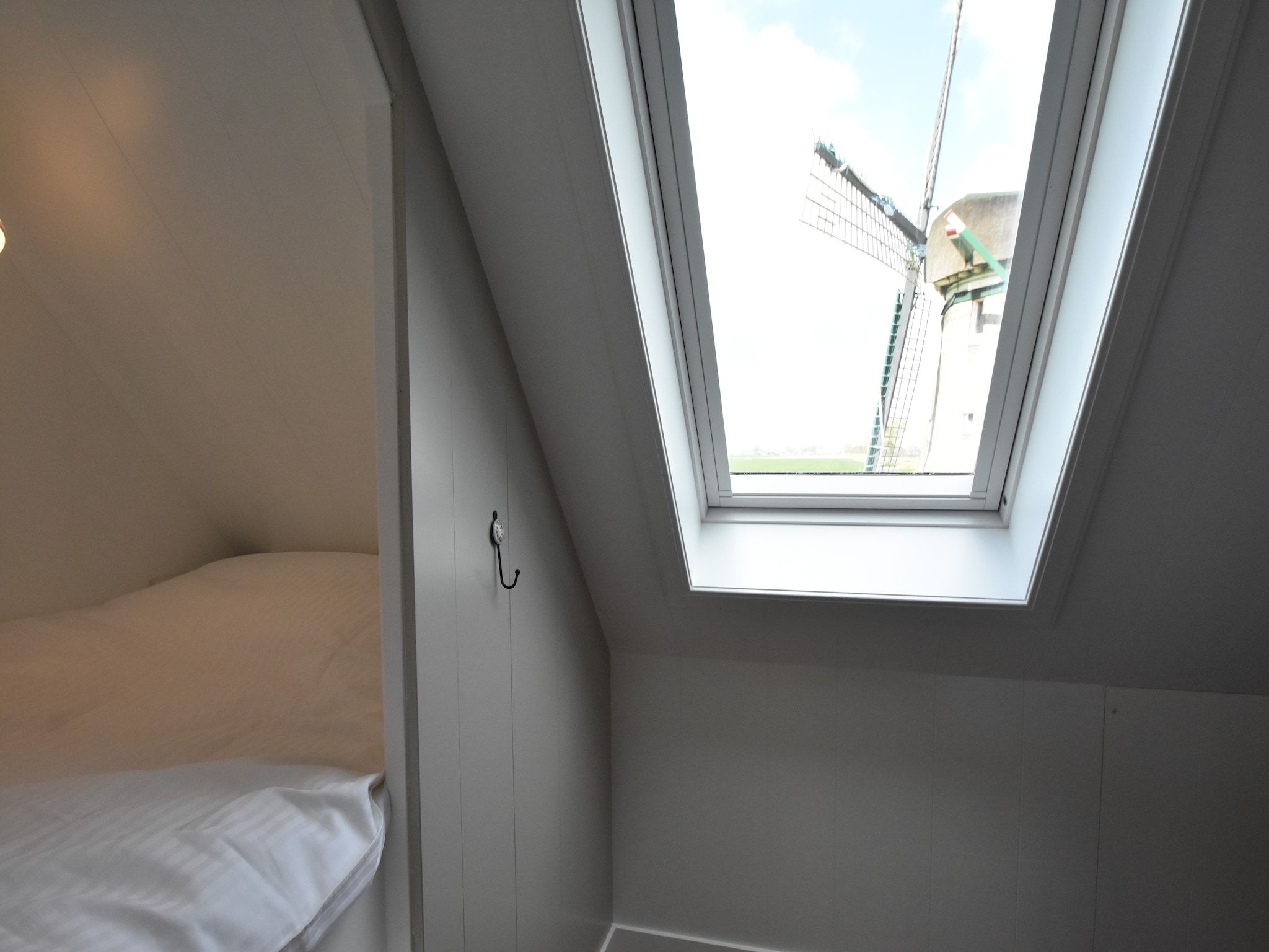 Een slaapkamer van Onder de Molen 24 pers in Middenbeemster