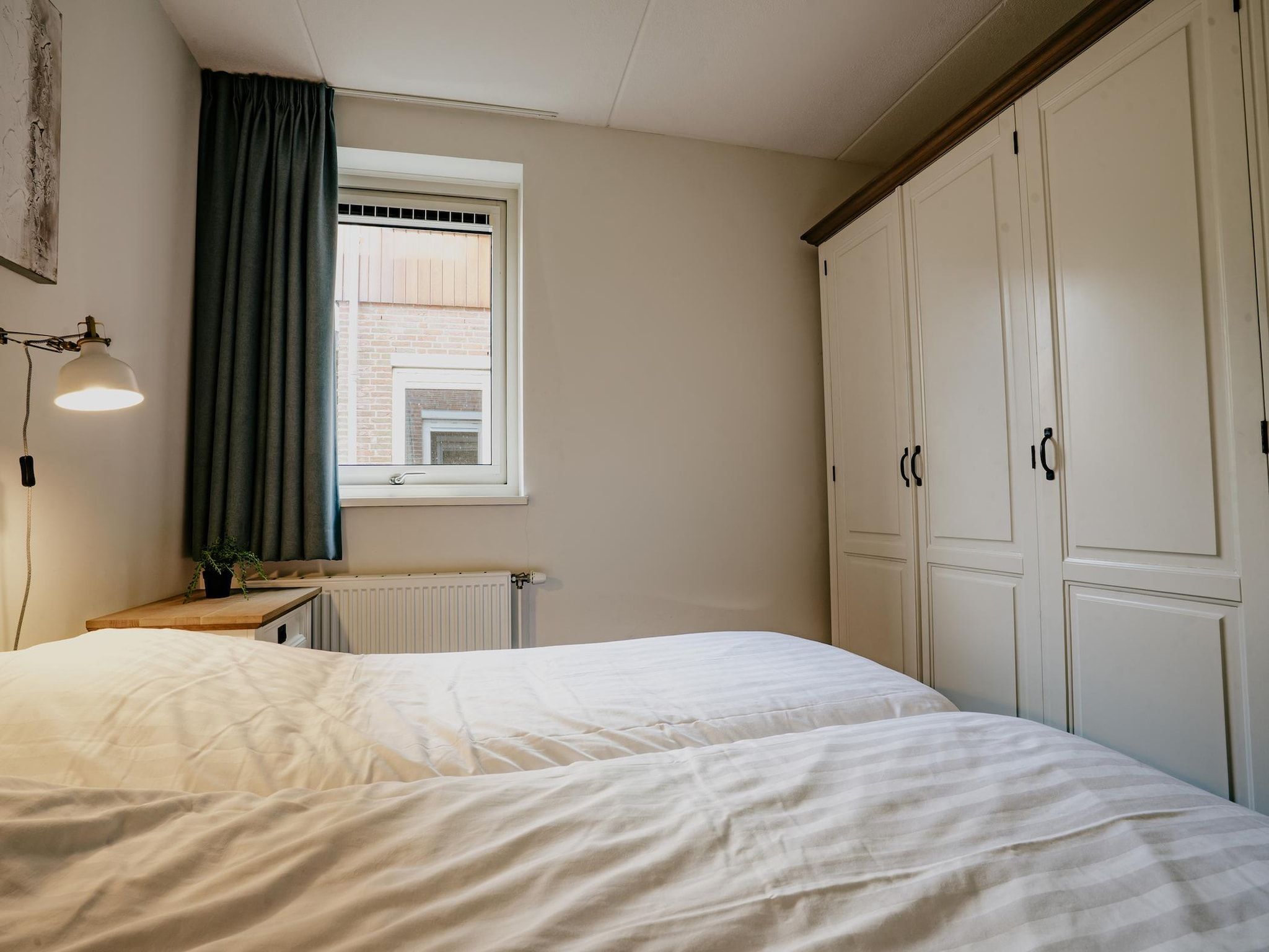 Een slaapkamer van Waterpark de Meerparel 8 in Uitgeest