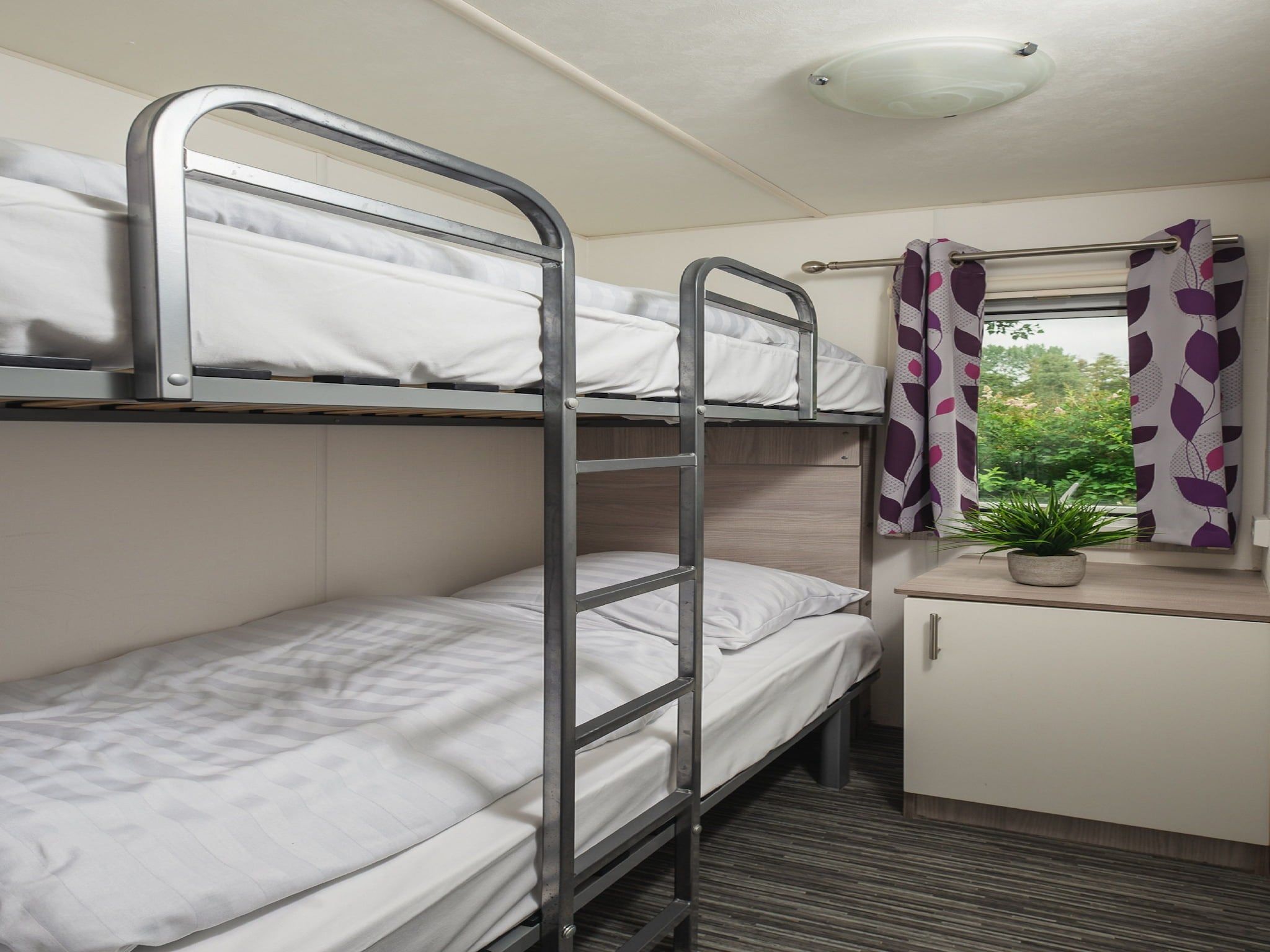 Een slaapkamer van Vakantiepark Mölke 5 in Zuna