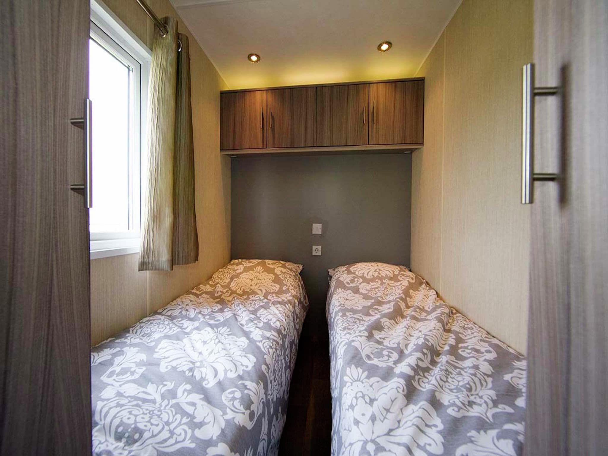 Een slaapkamer van Vakantiepark Mölke 10 in Zuna