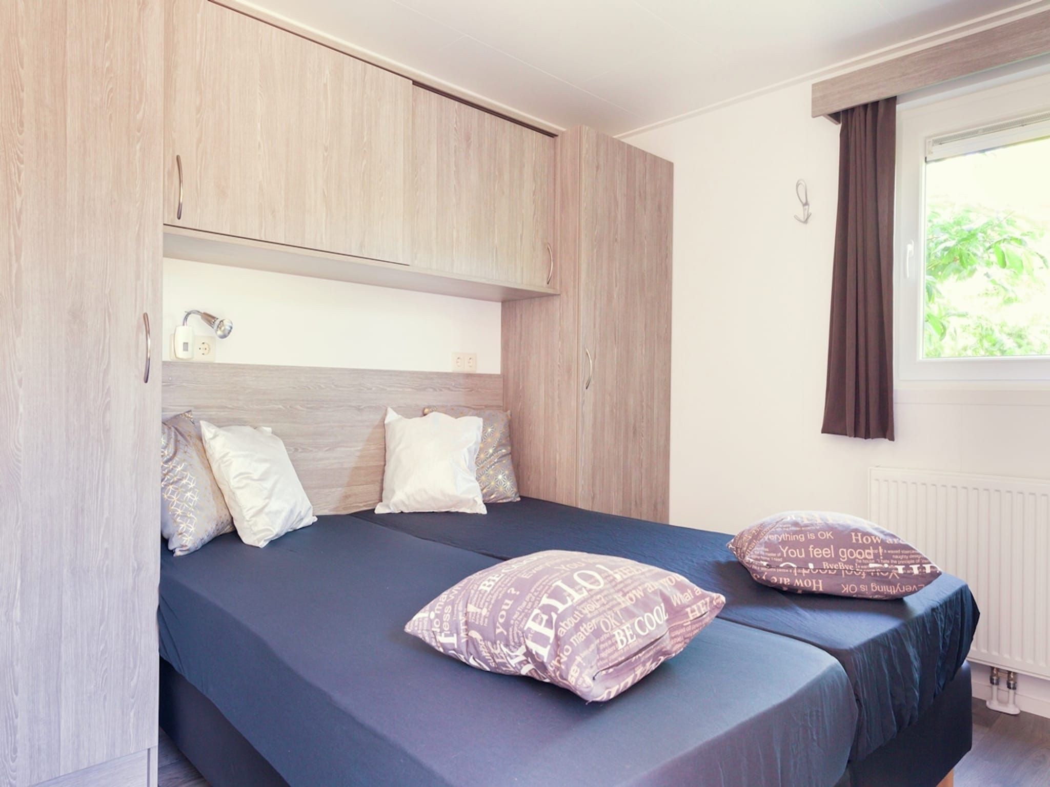 Een slaapkamer van Vakantiepark Mölke 11 in Zuna