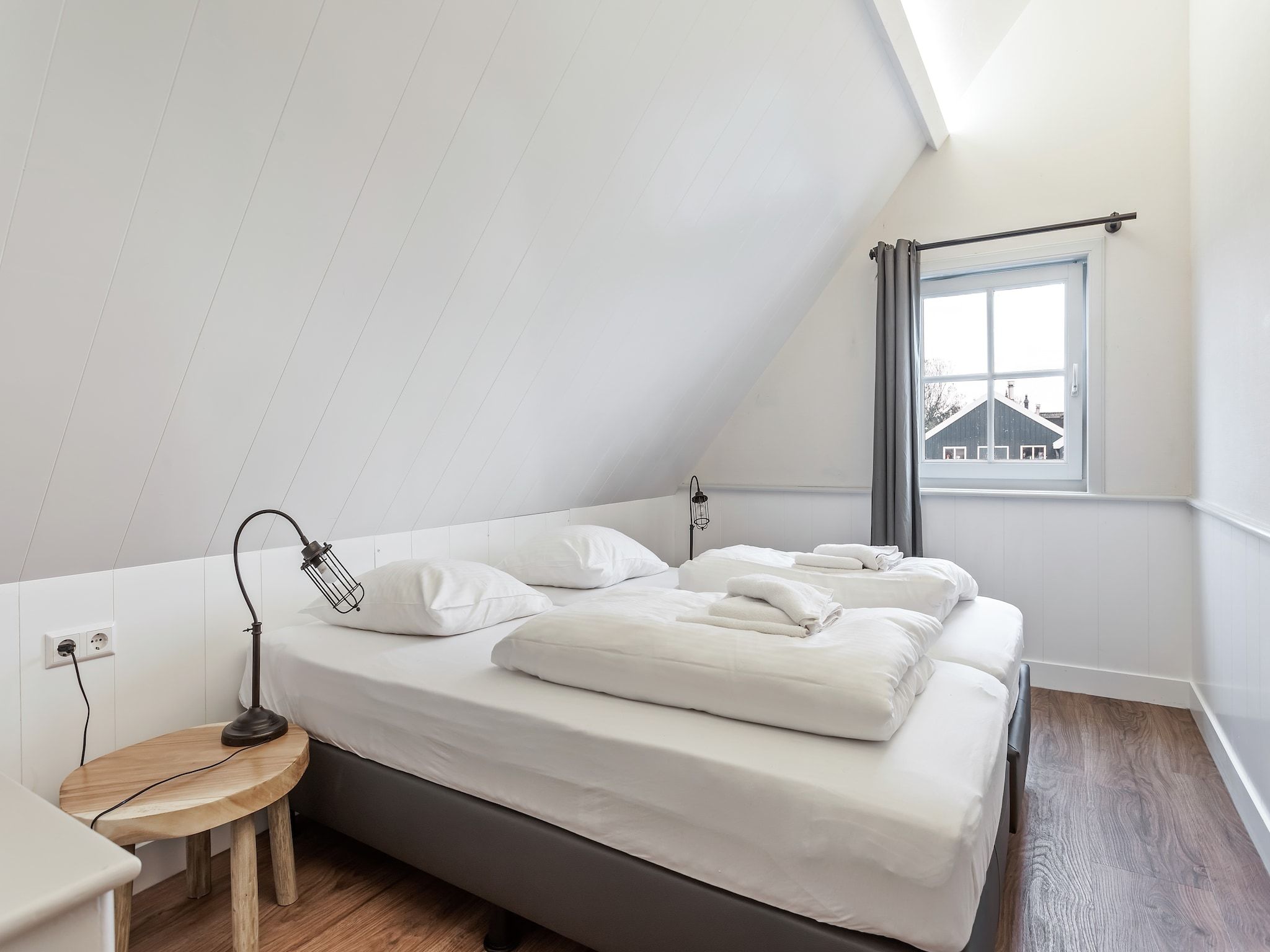 Een slaapkamer van Onder de Molen 10 pers in Middenbeemster