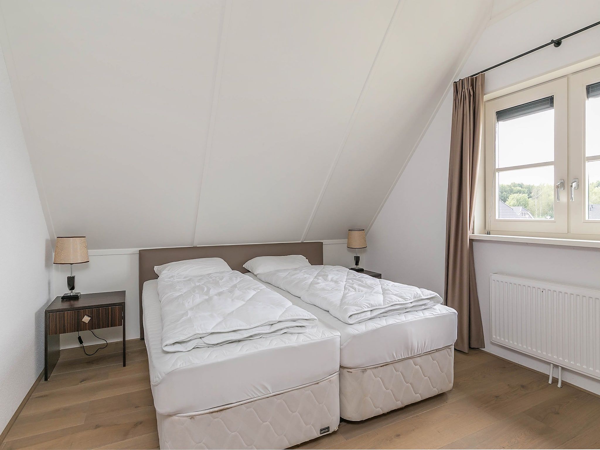 Een slaapkamer van Villaparc Schoonhovenseland in Hollandscheveld