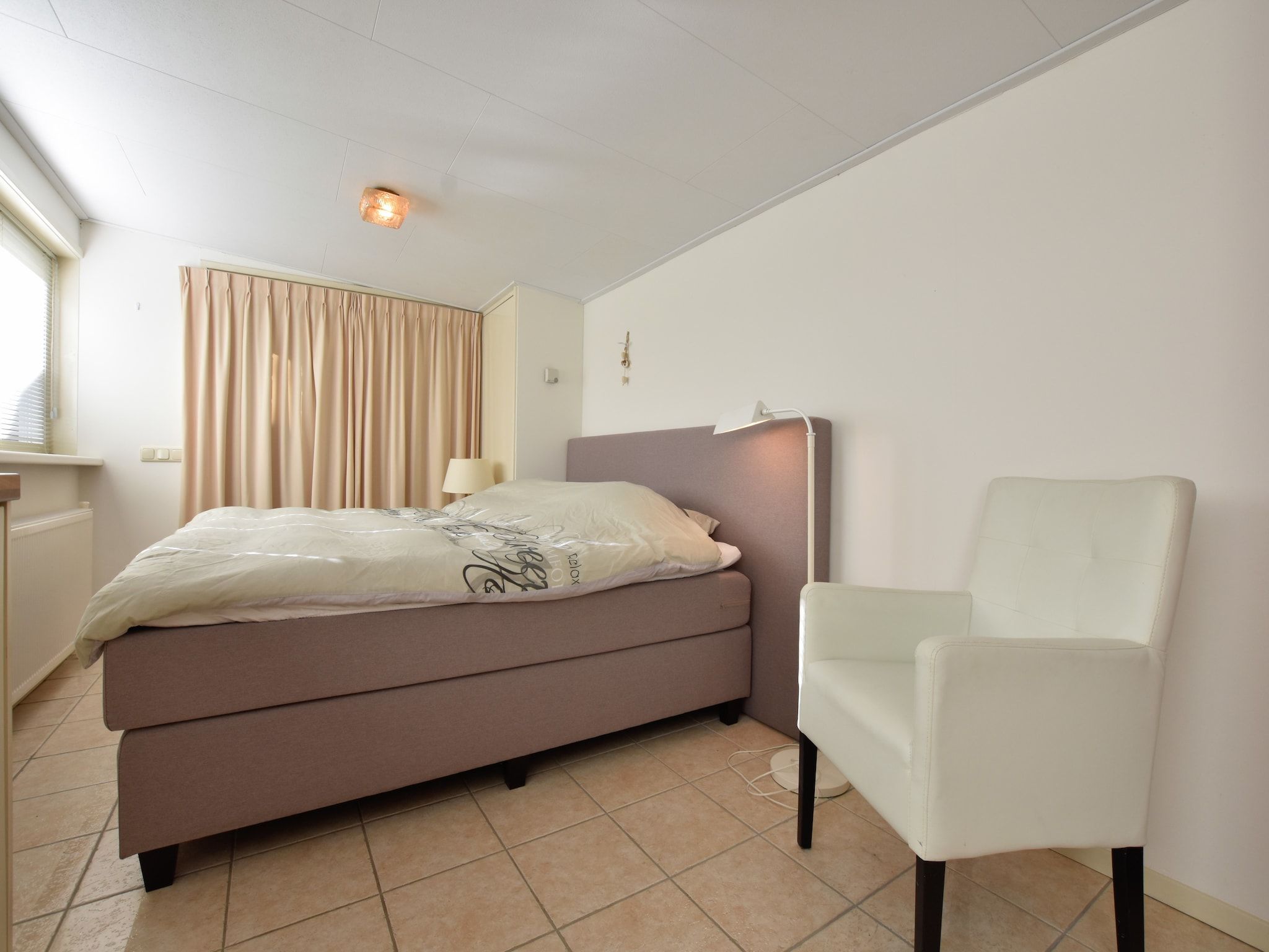 Een slaapkamer van Poort naar de Veluwe in Voorthuizen