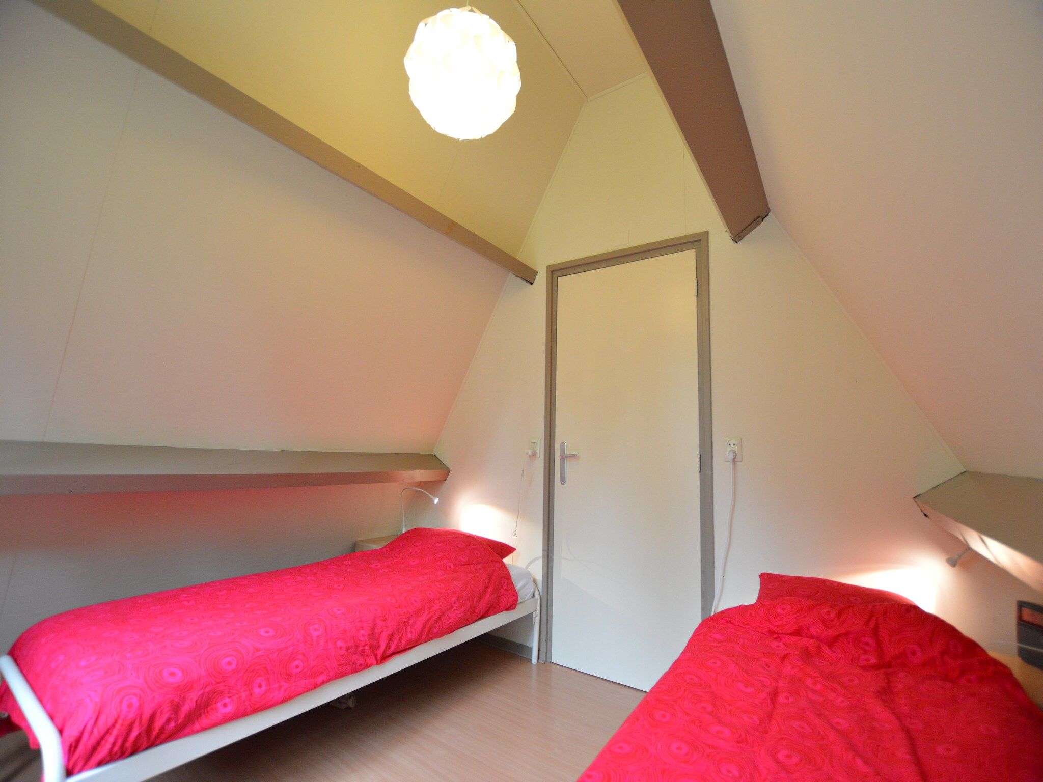 Een slaapkamer van Bungalow 87 in Stramproy