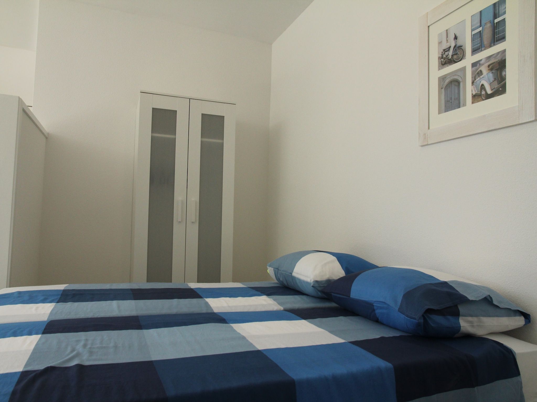 Een slaapkamer van De Beukelaar 2pers in Schoorl