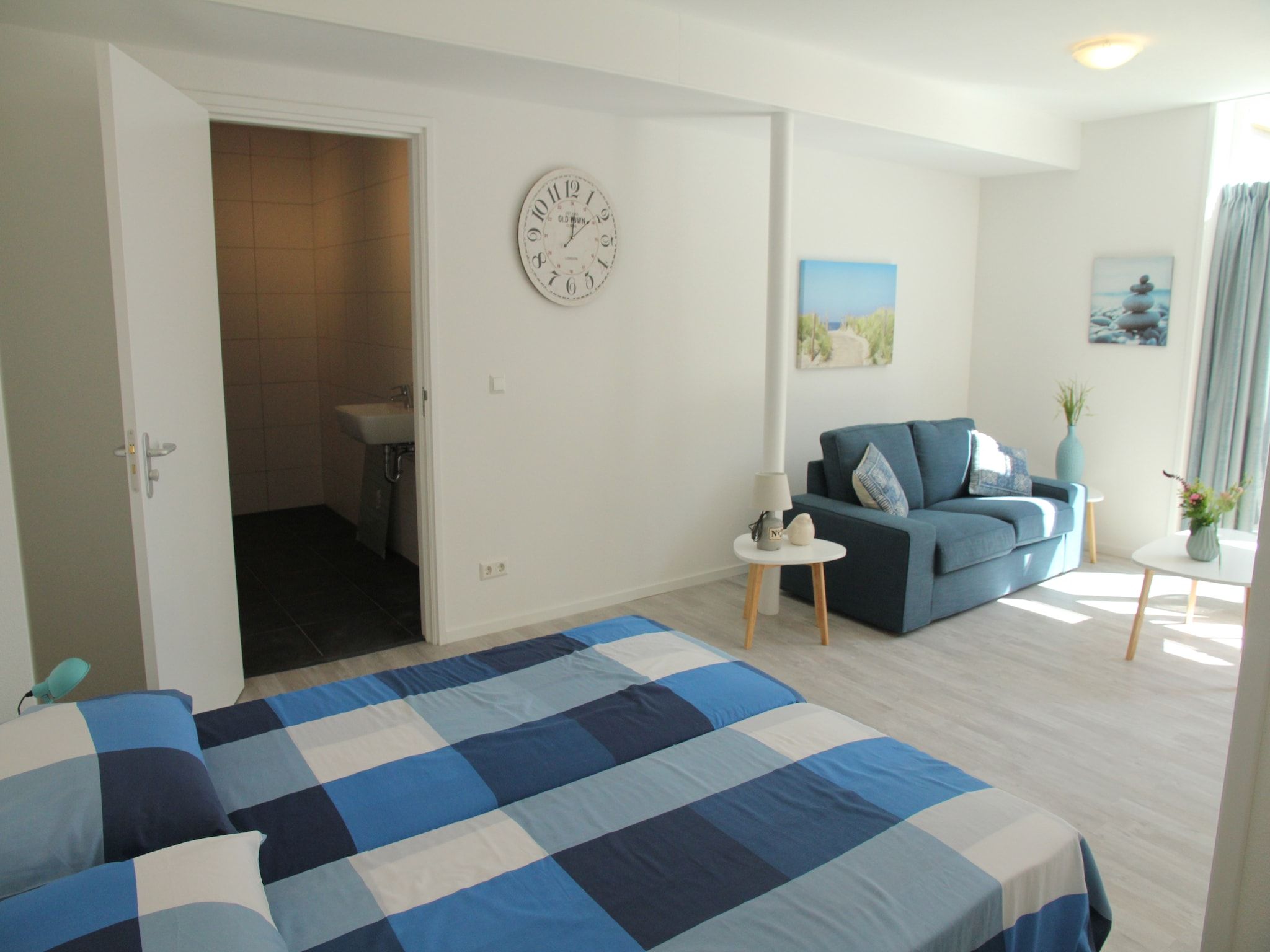 Een slaapkamer van De Beukelaar 2pers in Schoorl