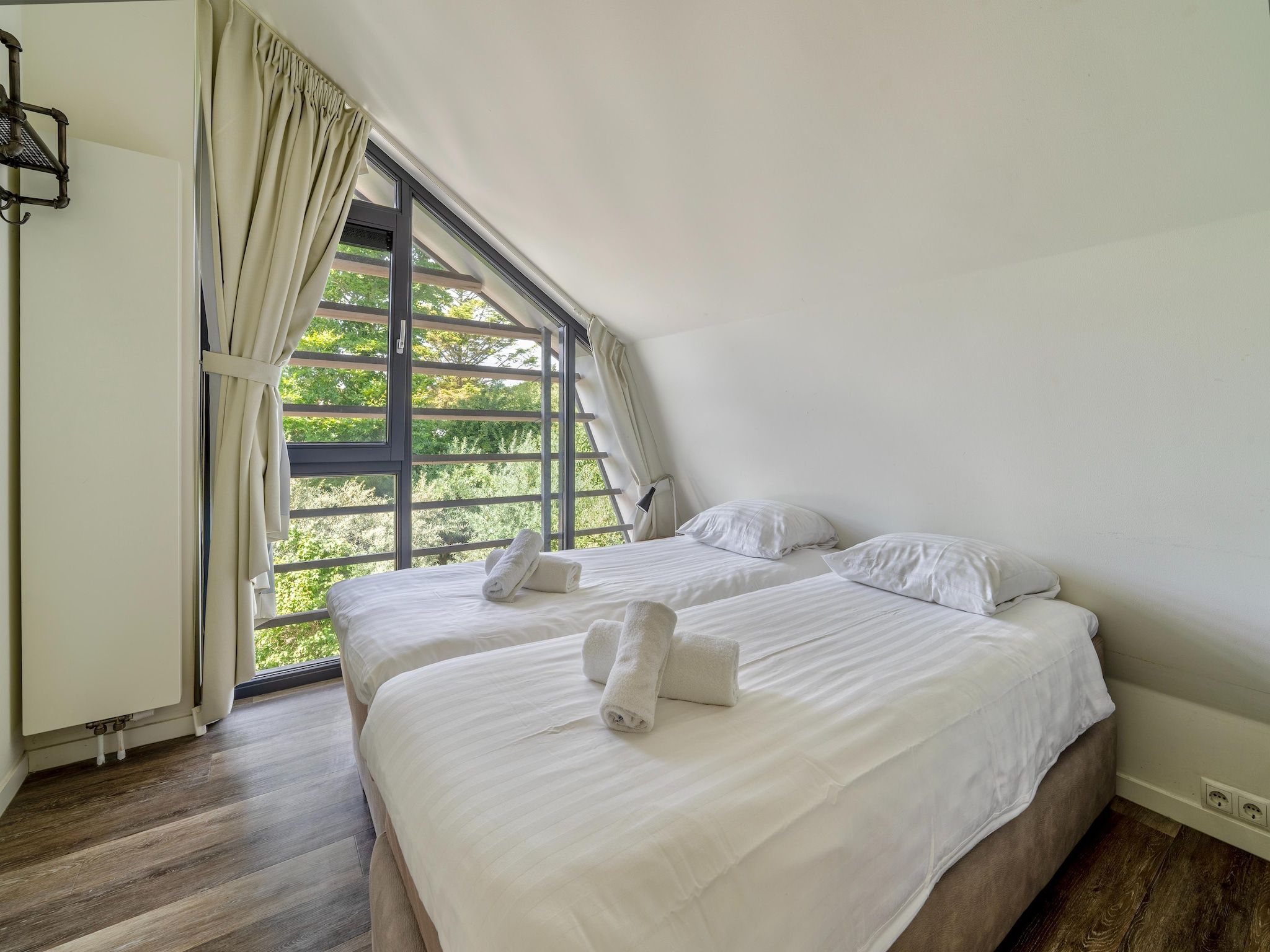 Een slaapkamer van Villa Egmond in Egmond aan den Hoef