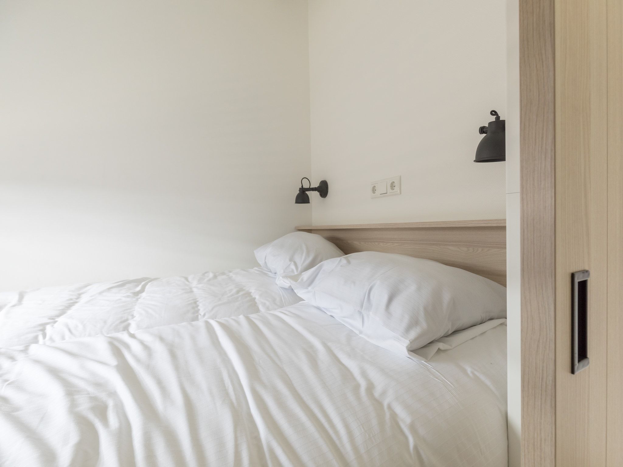 Een slaapkamer van Sea Lodges Ameland 1 in Hollum