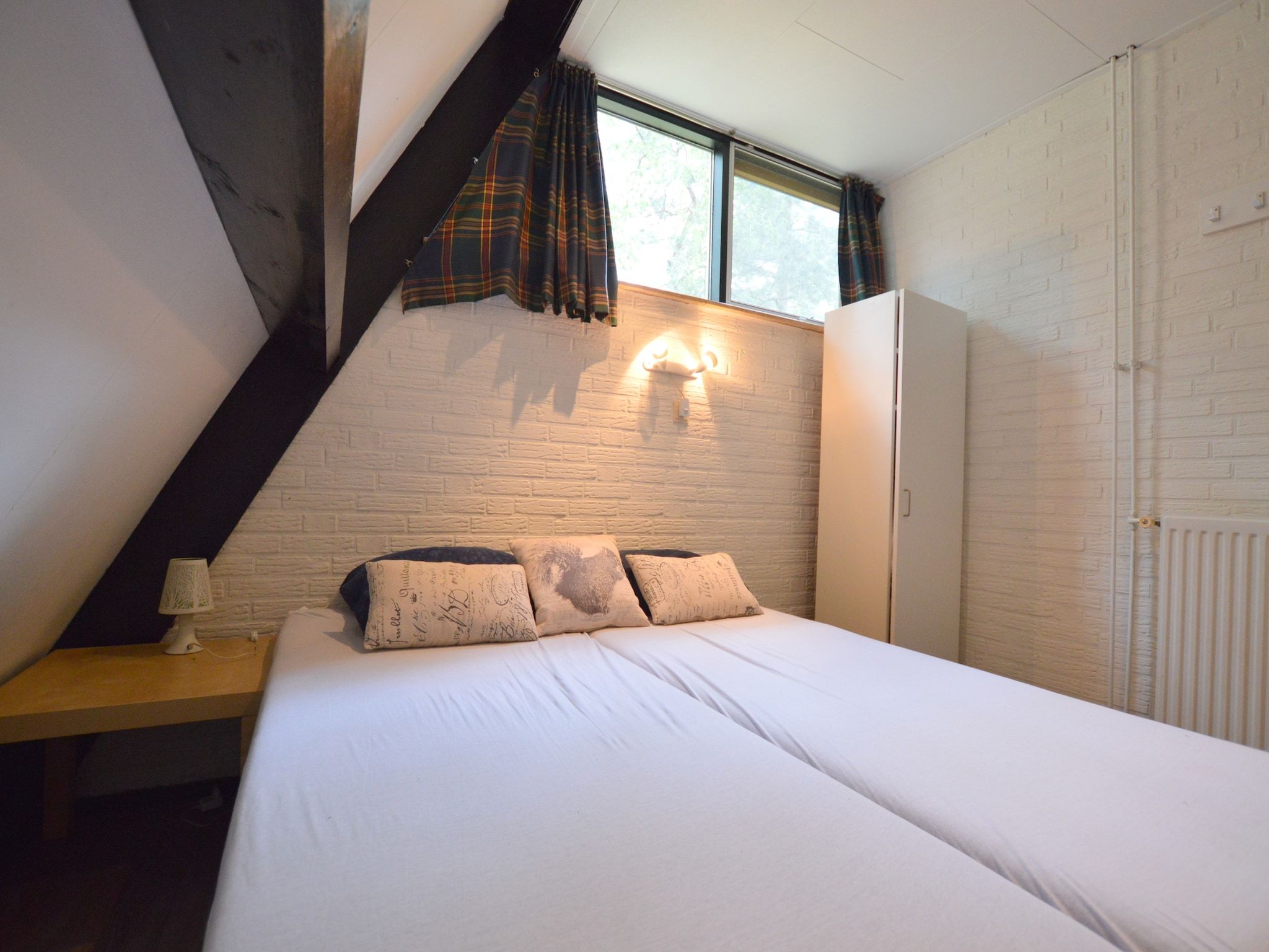 Een slaapkamer van Bungalow 86 in Stramproy