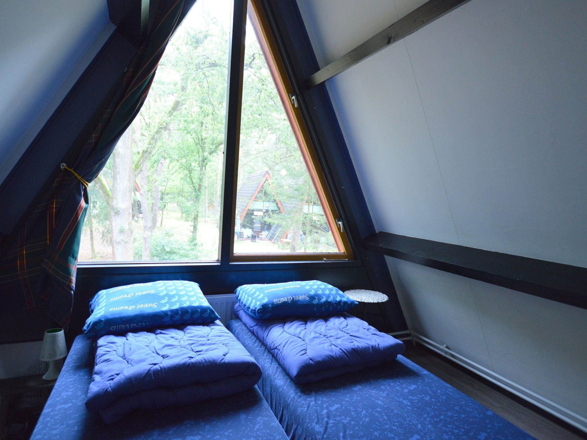 Een slaapkamer van Bungalow 86 in Stramproy