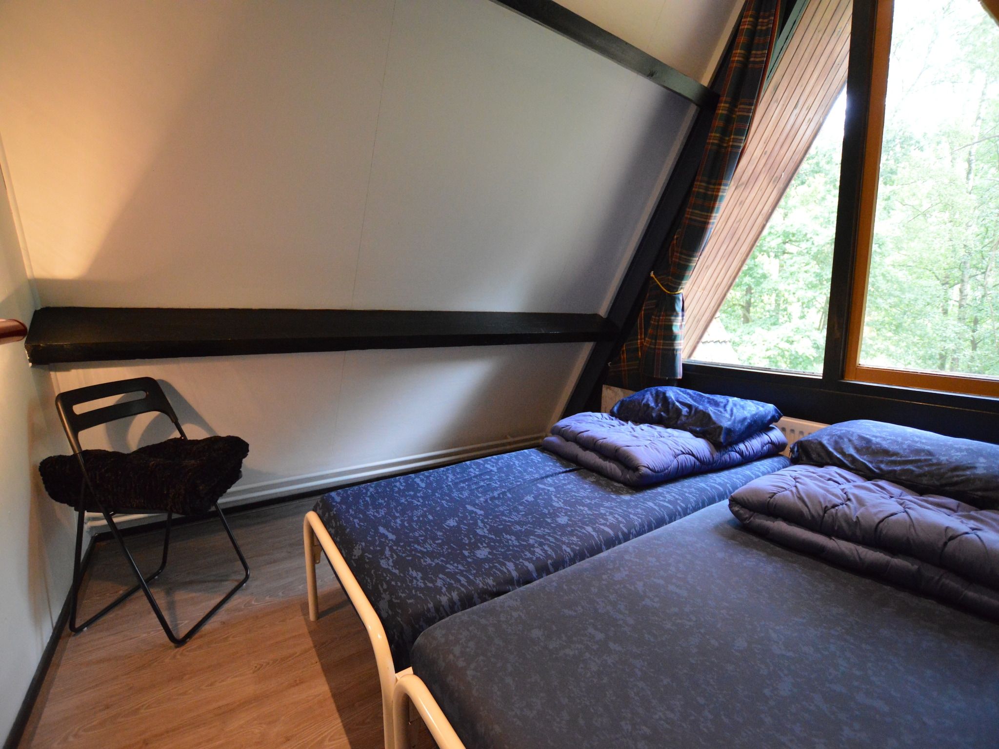 Een slaapkamer van Bungalow 86 in Stramproy