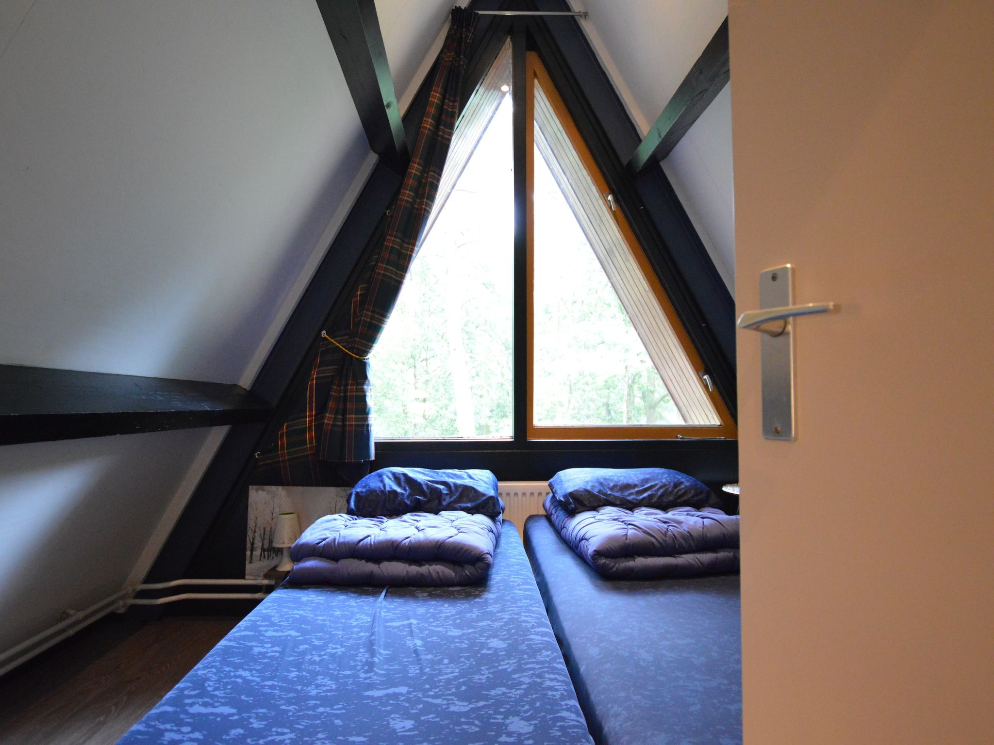 Een slaapkamer van Bungalow 86 in Stramproy