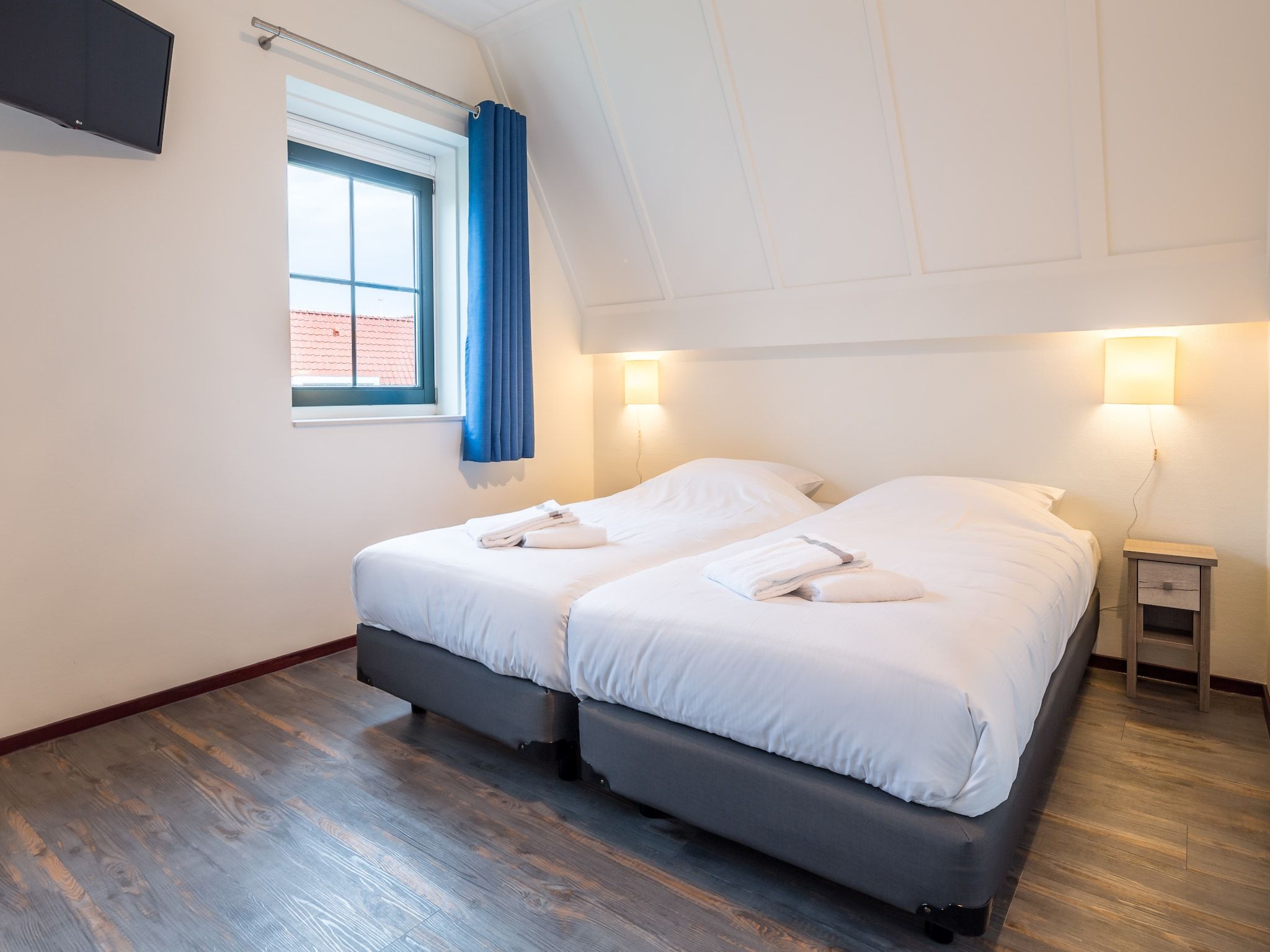 Een slaapkamer van Marinapark Volendam 3 in Volendam