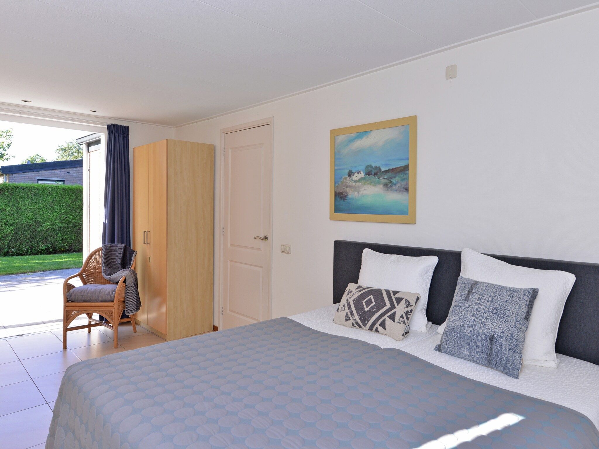 Een slaapkamer van Saturnuslaan 14 in Kamperland