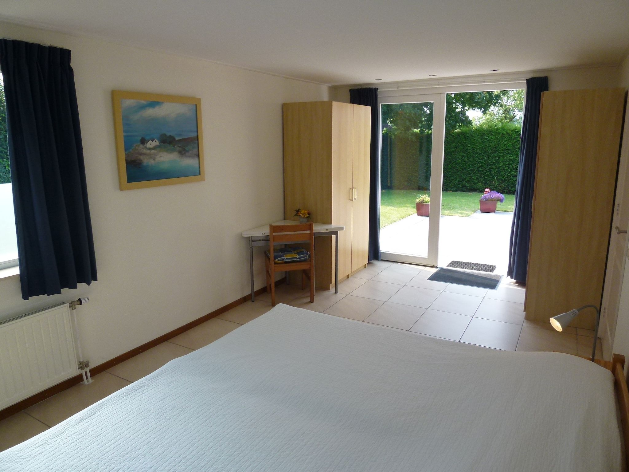 Een slaapkamer van Saturnuslaan 14 in Kamperland