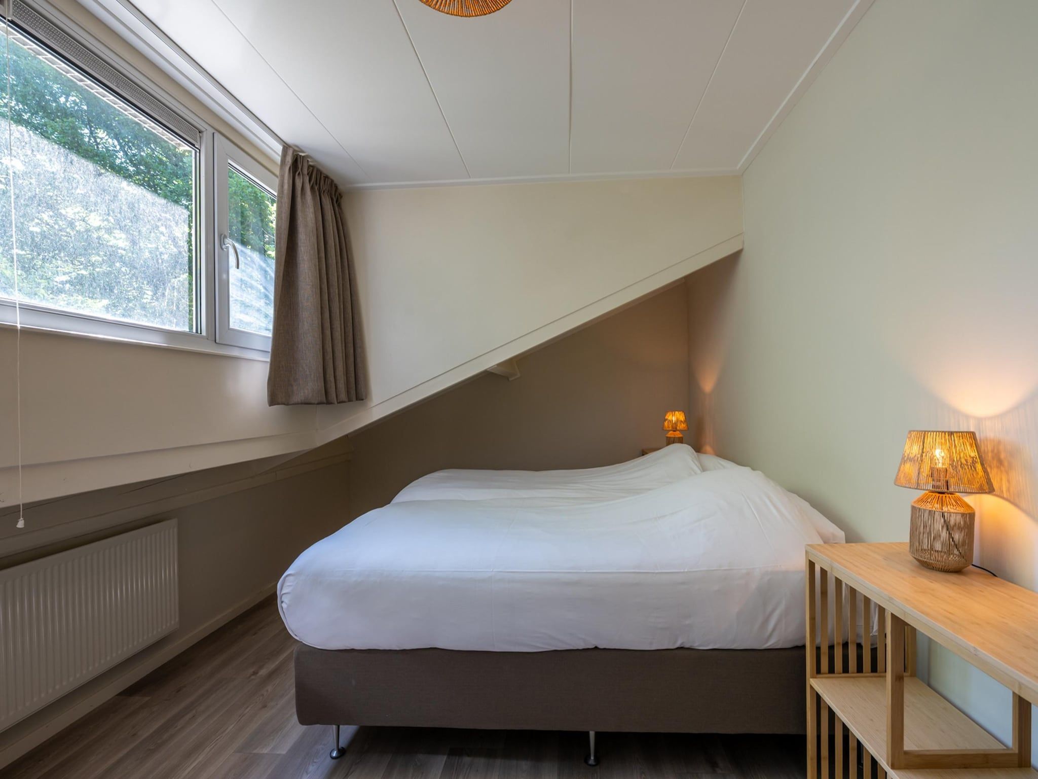 Een slaapkamer van Wilgenlaan 1 in Kamperland