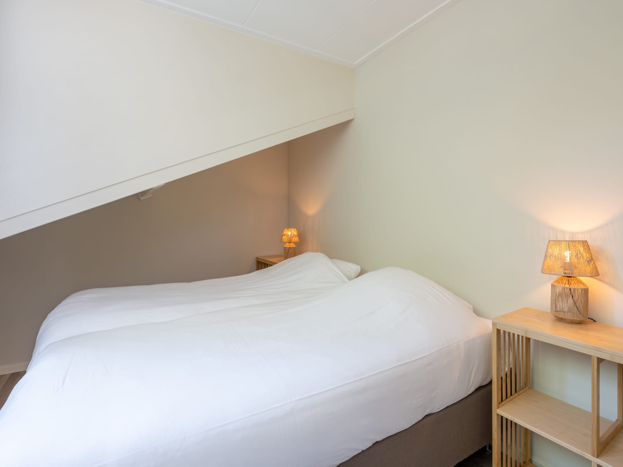 Een slaapkamer van Wilgenlaan 1 in Kamperland