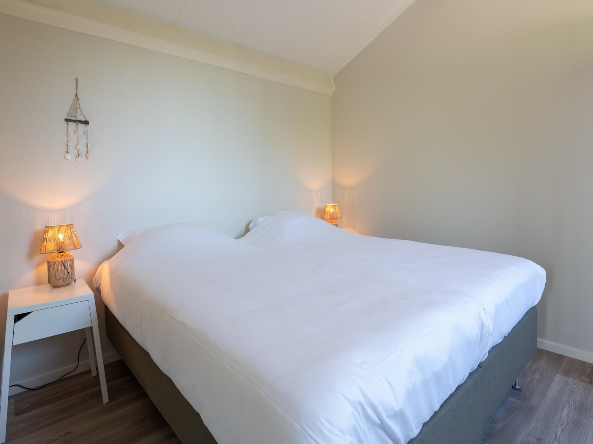 Een slaapkamer van Wilgenlaan 1 in Kamperland