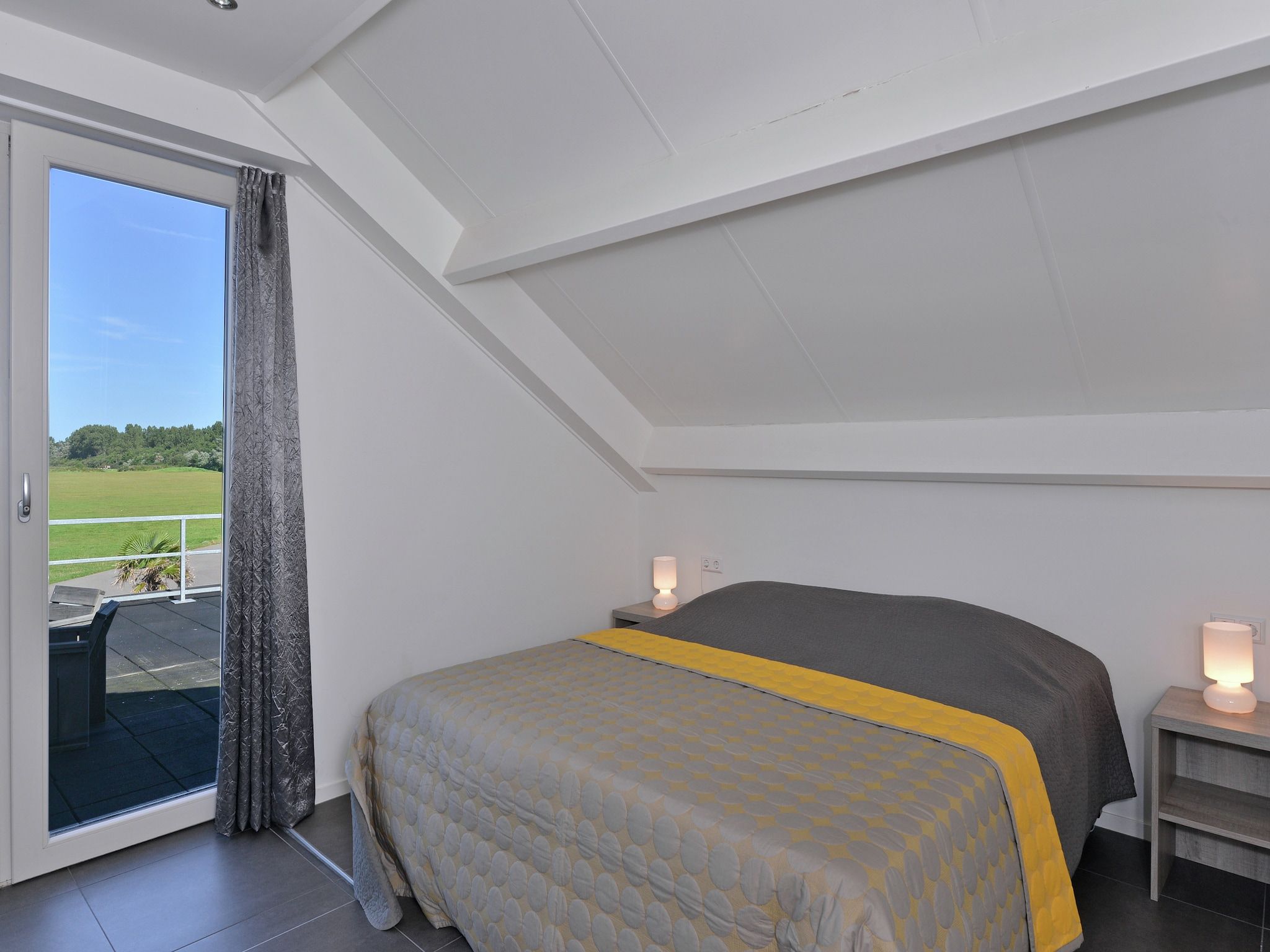 Een slaapkamer van Penthouse XXL 4ab in Kamperland