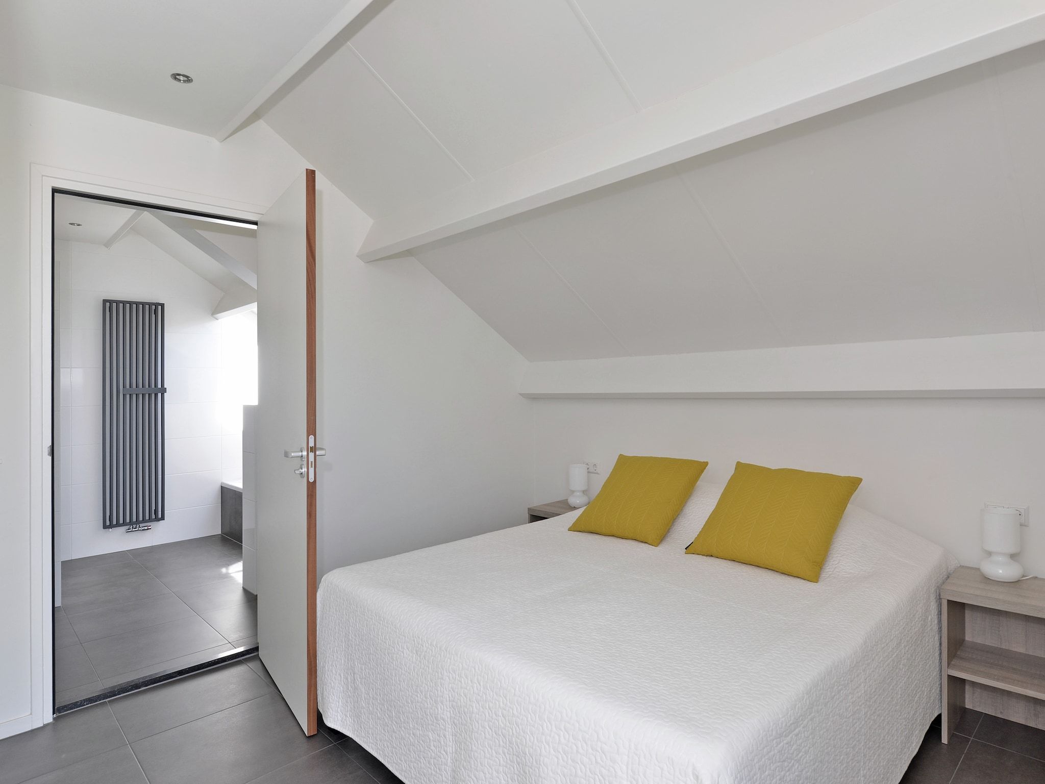 Een slaapkamer van Penthouse 4a - De Schotsman Watersport in Kamperland