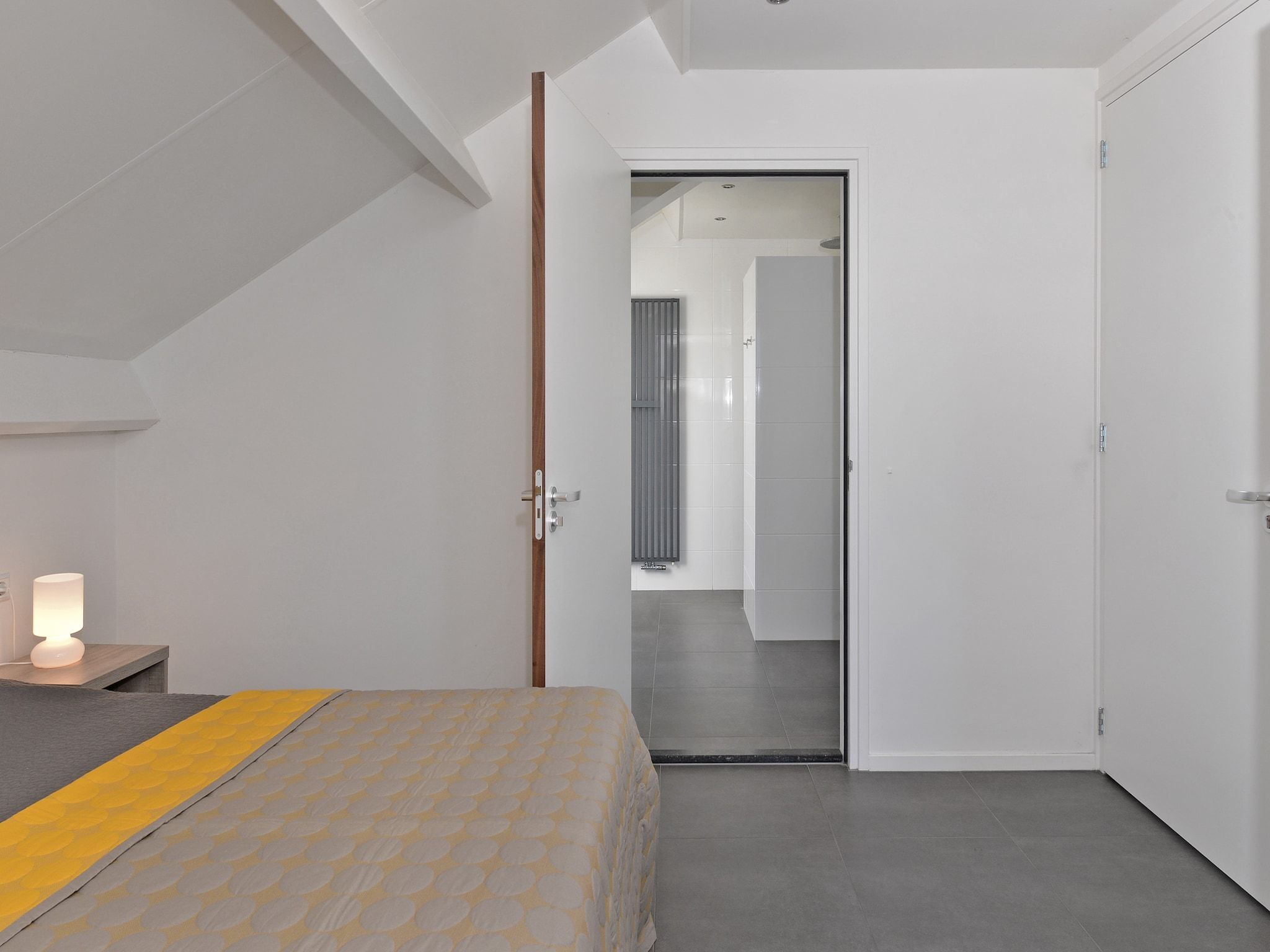 Een slaapkamer van Penthouse 4a - De Schotsman Watersport in Kamperland