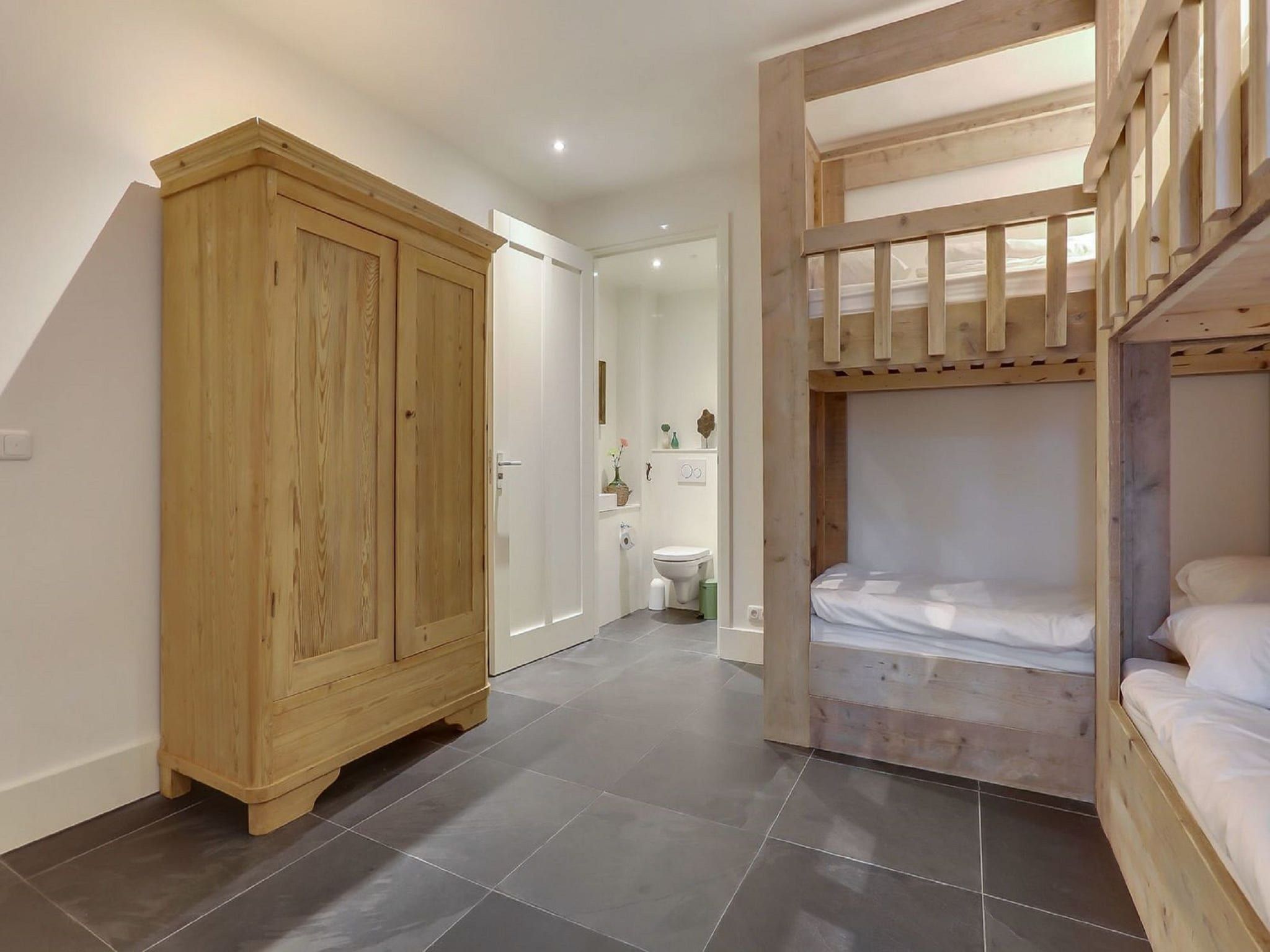 Een slaapkamer van Vakantiepark Sandberghe 7 in Uden