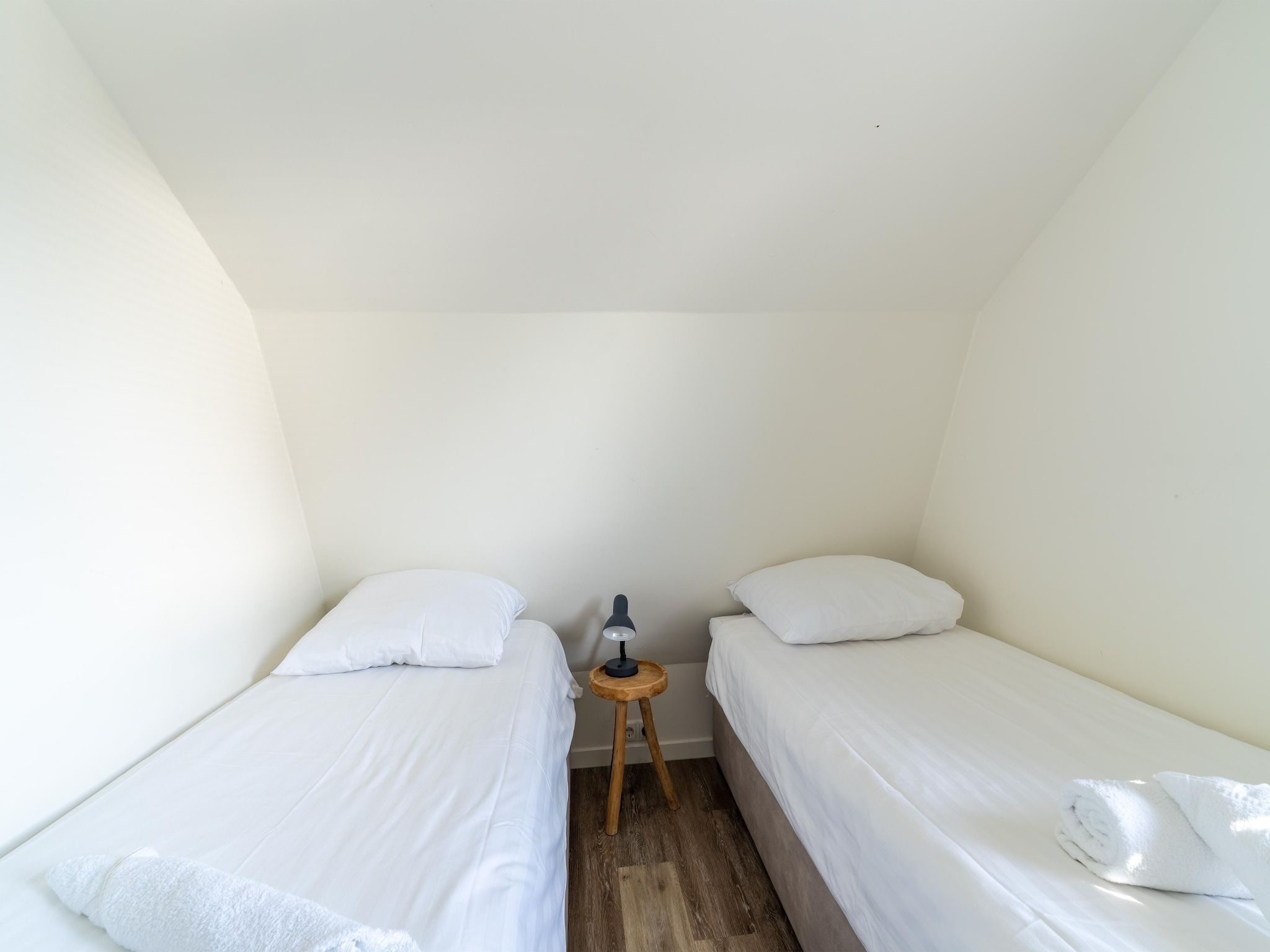 Een slaapkamer van Waterland in Egmond aan den Hoef